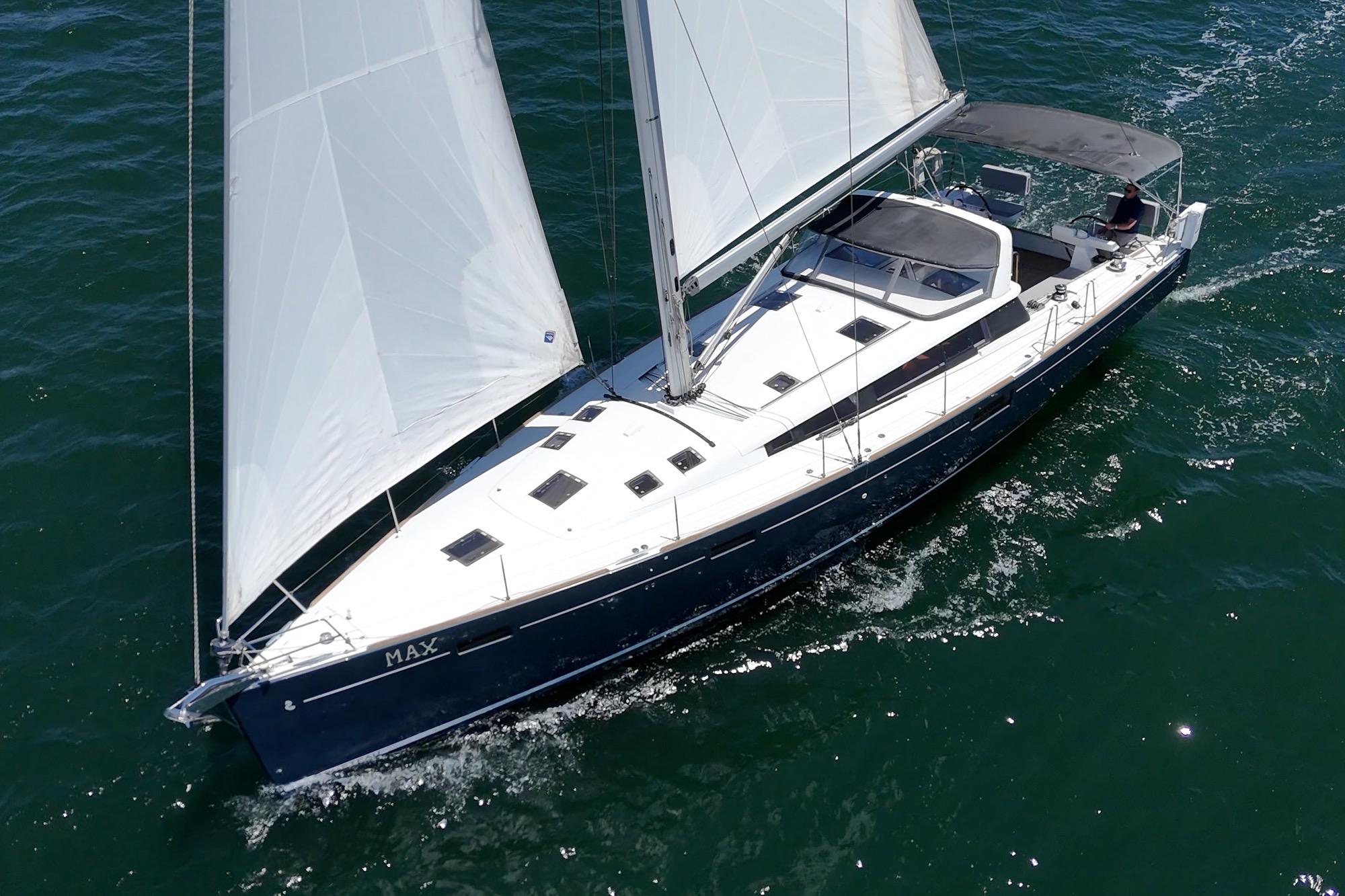 2017 Beneteau Sense 50 sailing yacht on open water, showcasing sleek design and white sails.