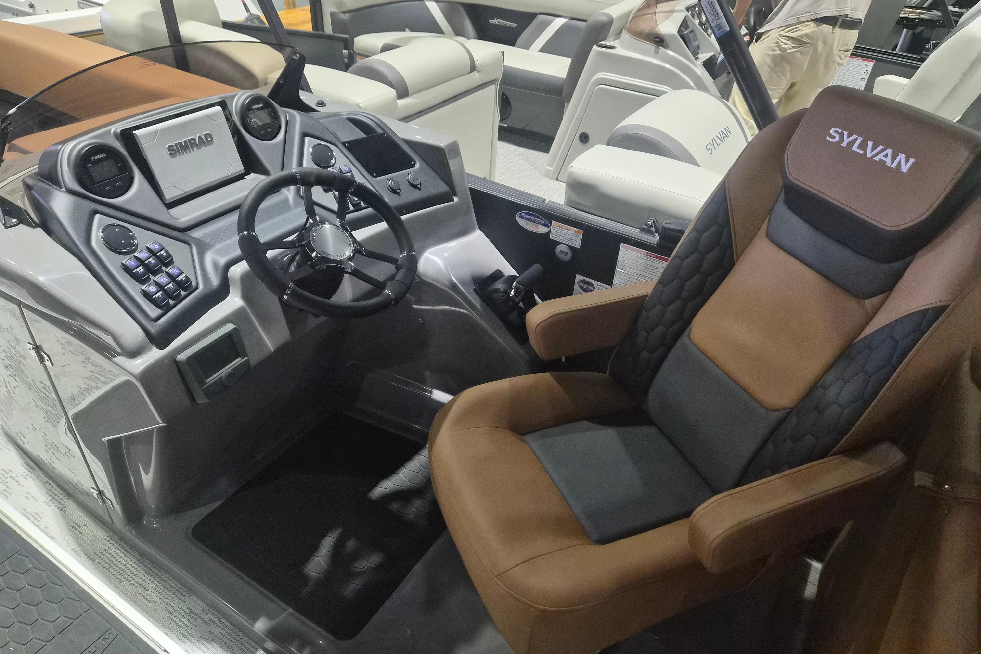 2026 Sylvan L3 SLZ boat interior with modern dashboard and luxurious seating.