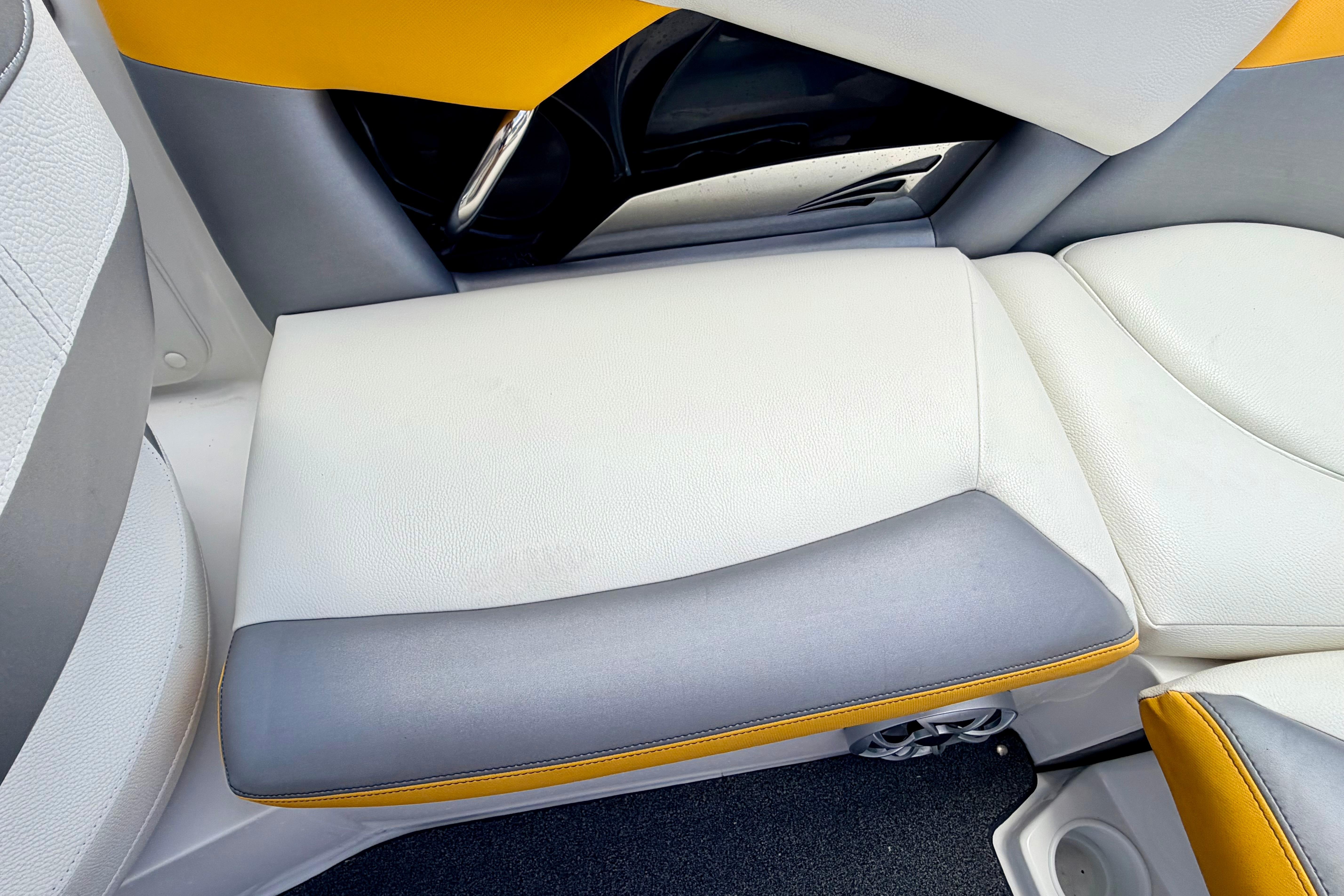 2014 Tigé R20 boat interior with white, gray, and yellow seating.