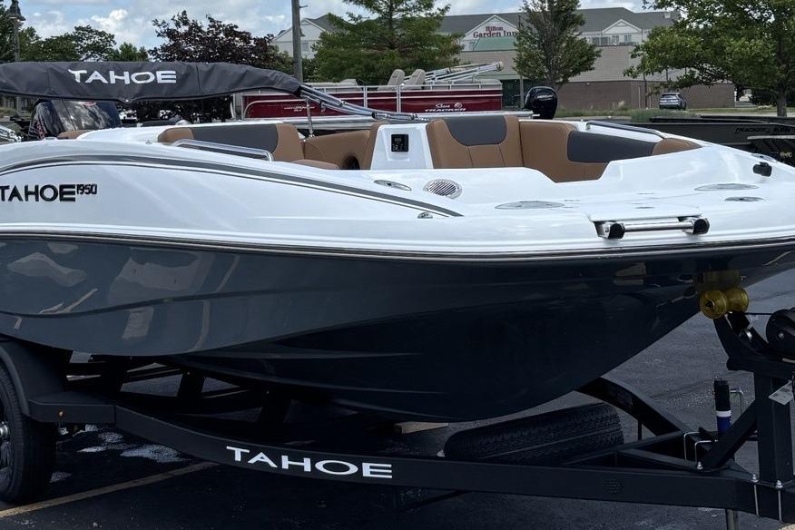 2026 Tahoe 1950 boat on trailer, sleek design, white and gray exterior.