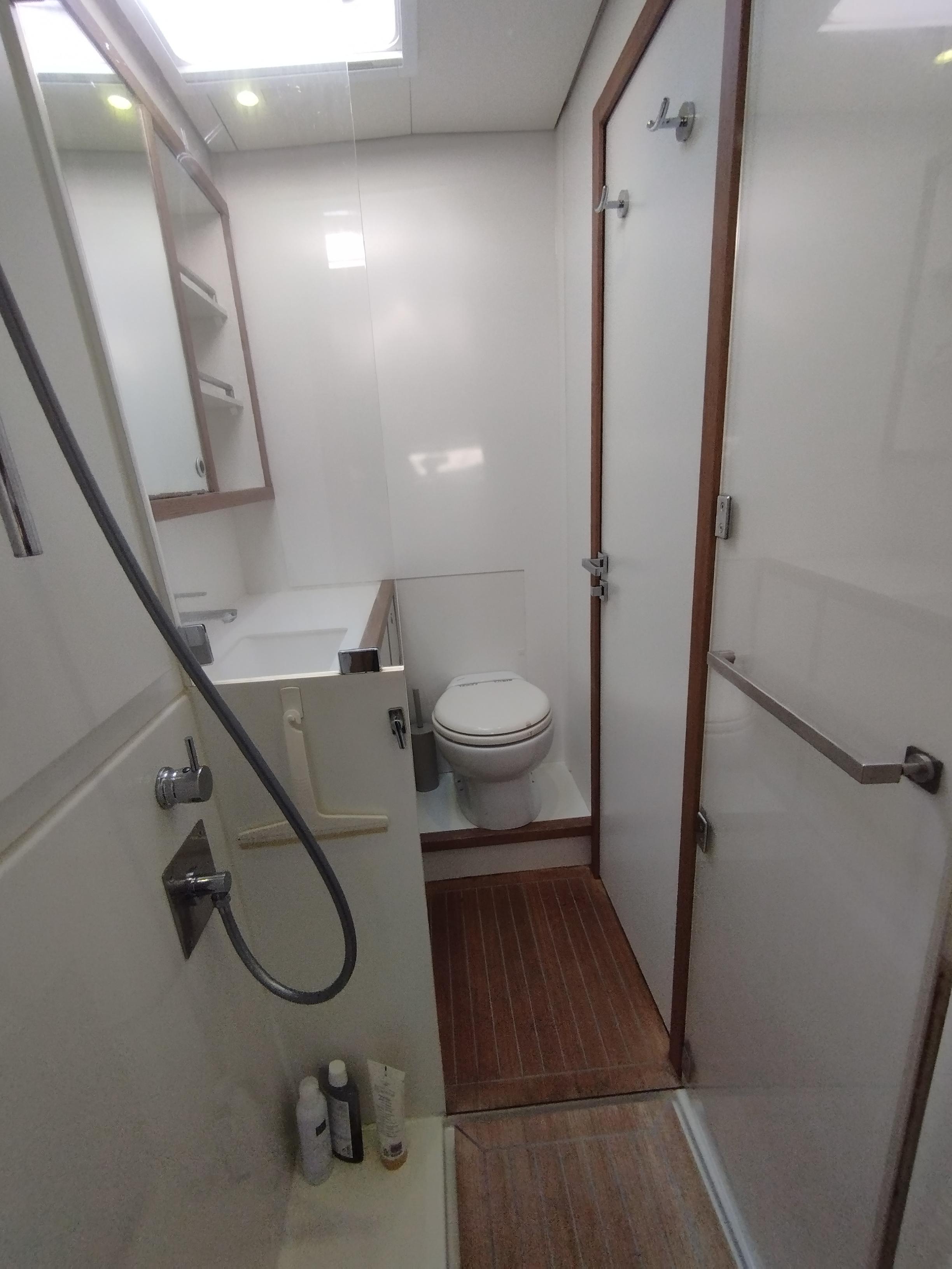 Bathroom interior of 2012 Lagoon 620 yacht with shower and toilet.