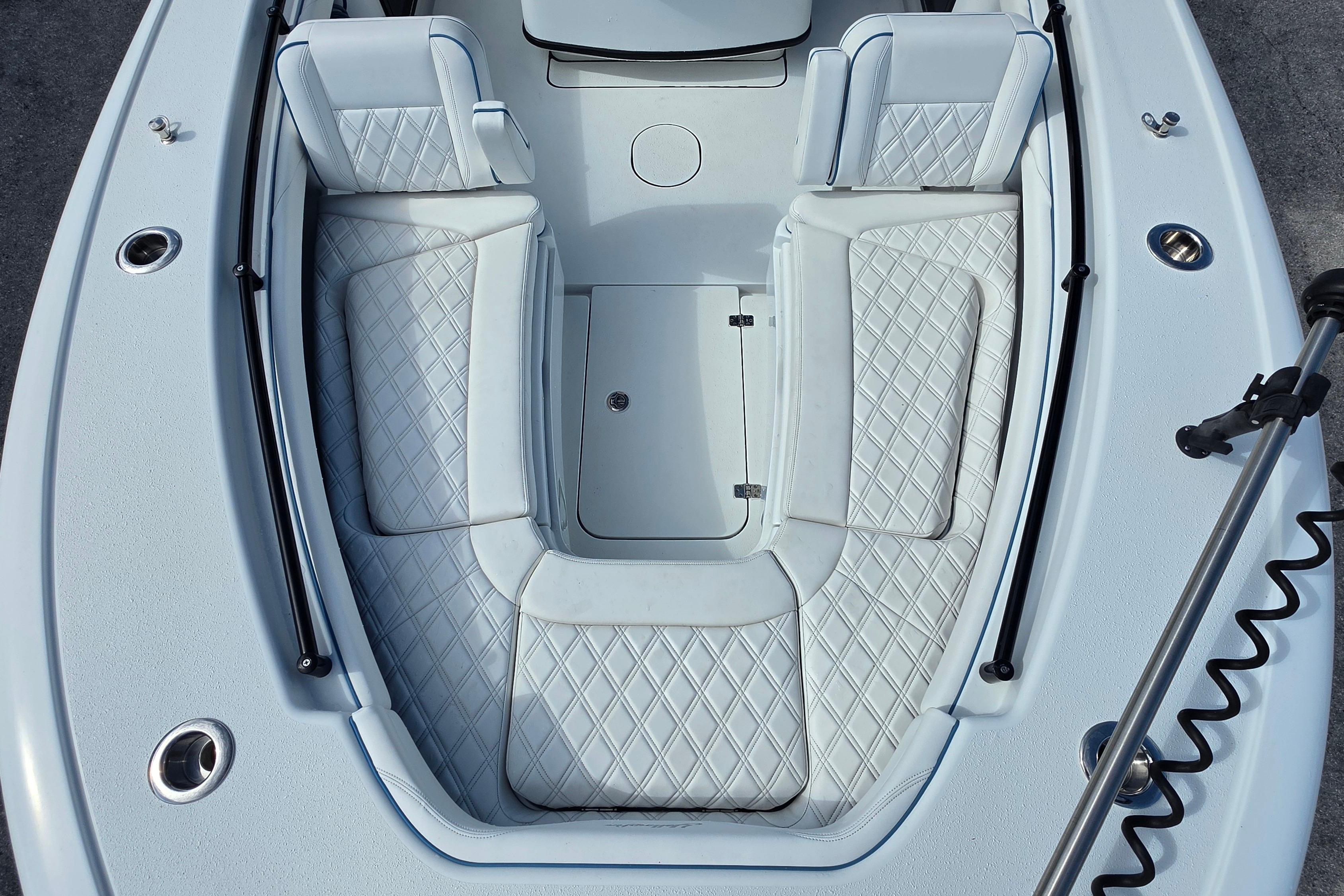 2025 Yellowfin 26 Hybrid boat interior with diamond-stitched seating and sleek design.