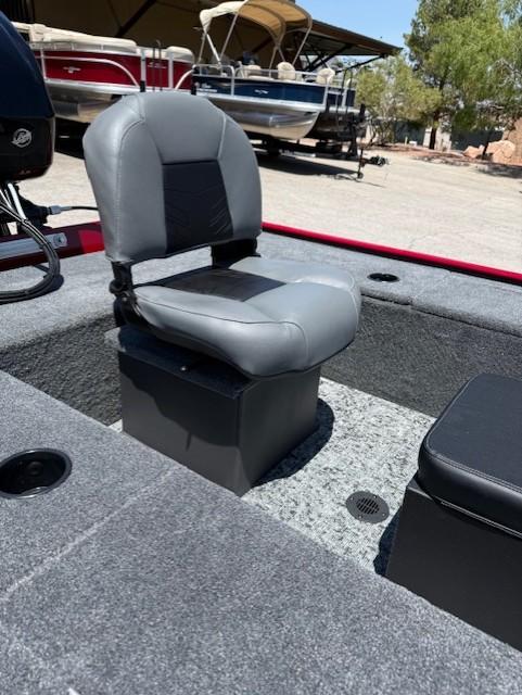 2025 Tracker Panfish 17 boat seat with gray upholstery, set in a carpeted deck.