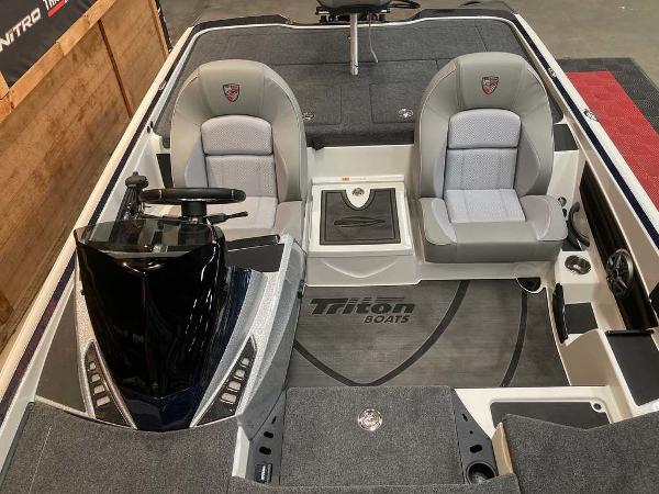 2025 Triton 20XP boat interior with dual seats and steering console.