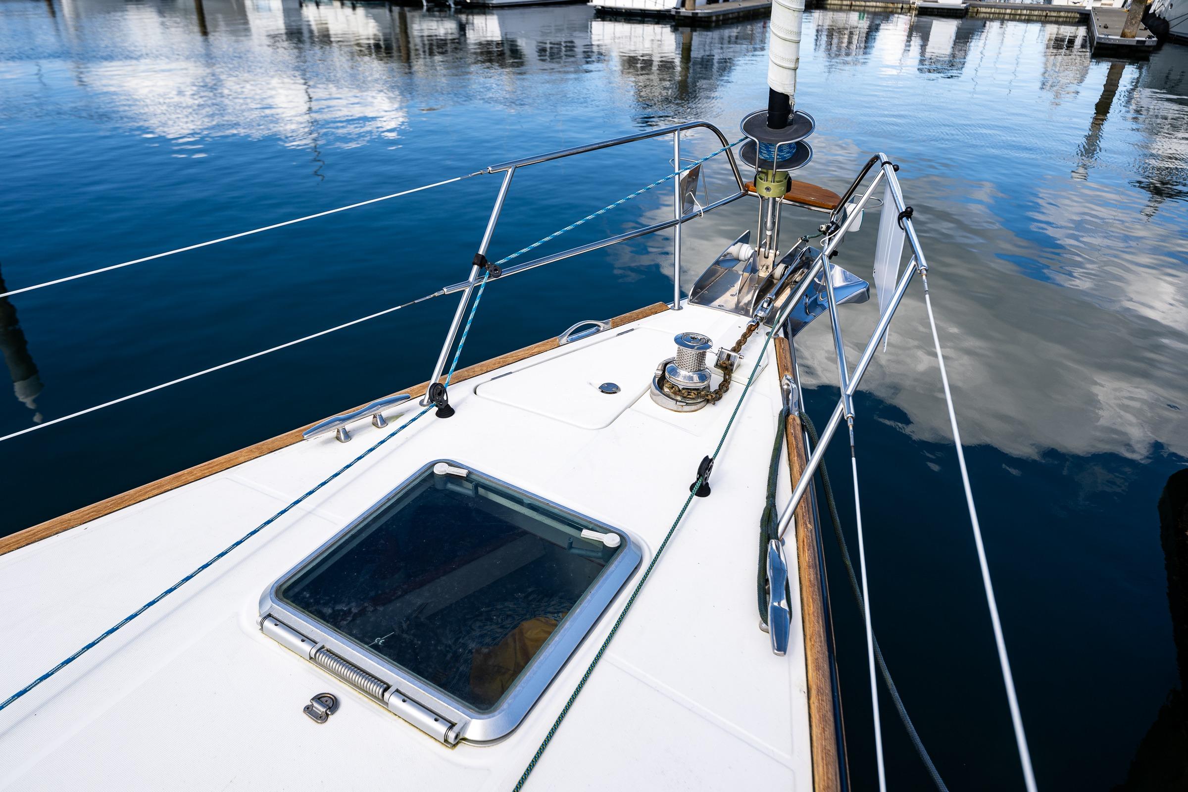 Deck of 2009 Jeanneau Sun Odyssey 54 DS sailboat at marina.