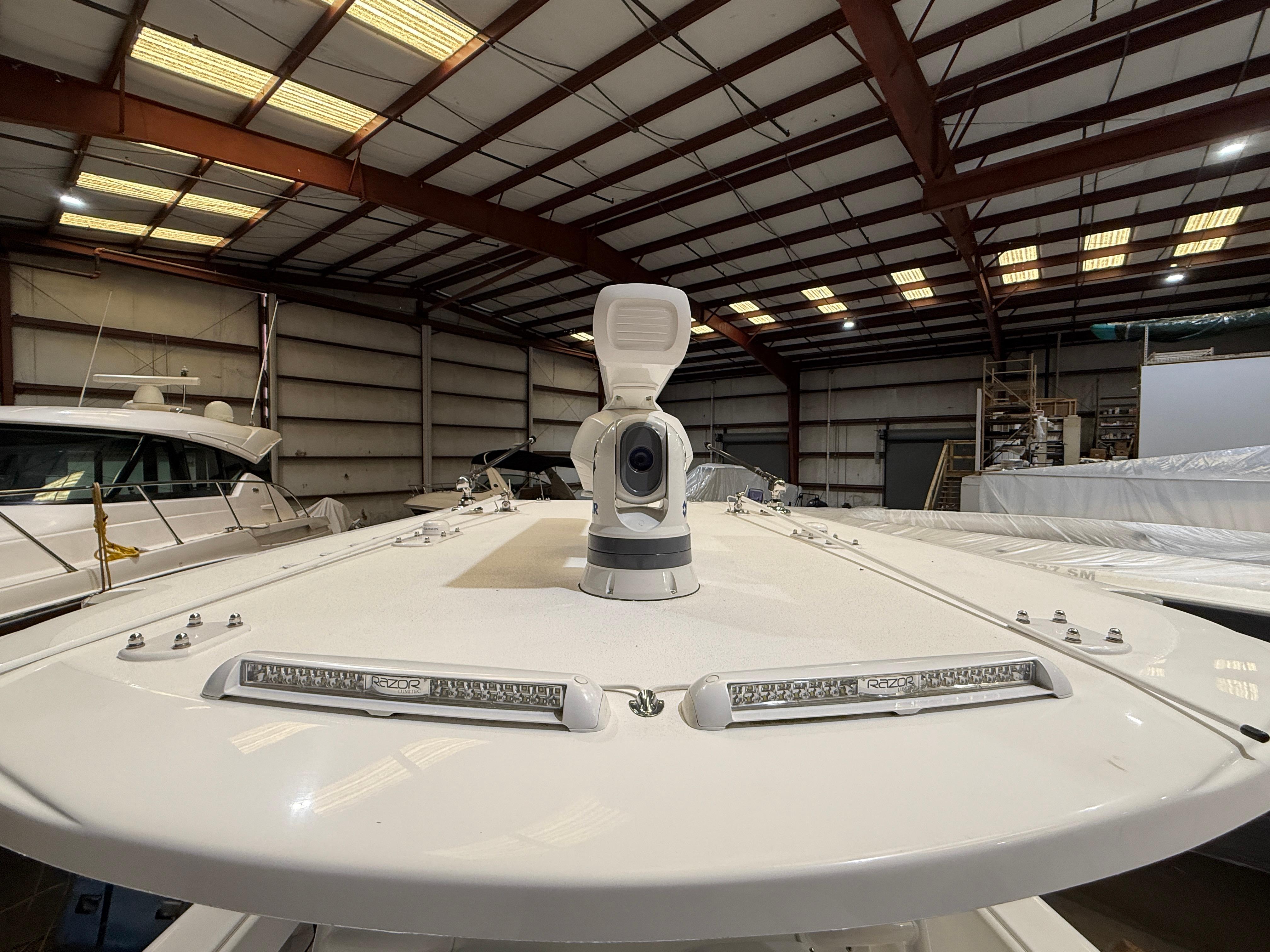 2022 Invincible 39 Open Fisherman boat in a warehouse, showcasing deck and equipment.