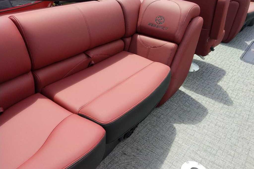 Luxurious red seating in 2026 Regency 230 DL boat, featuring premium upholstery and elegant design.