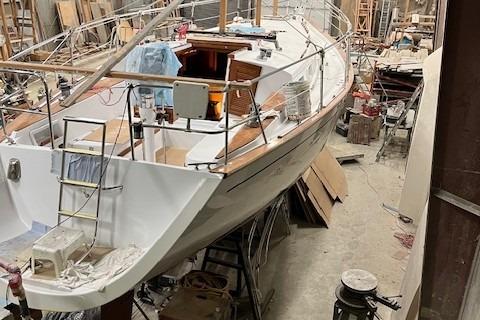 1983 Endeavour 35 sailboat under restoration in a workshop.