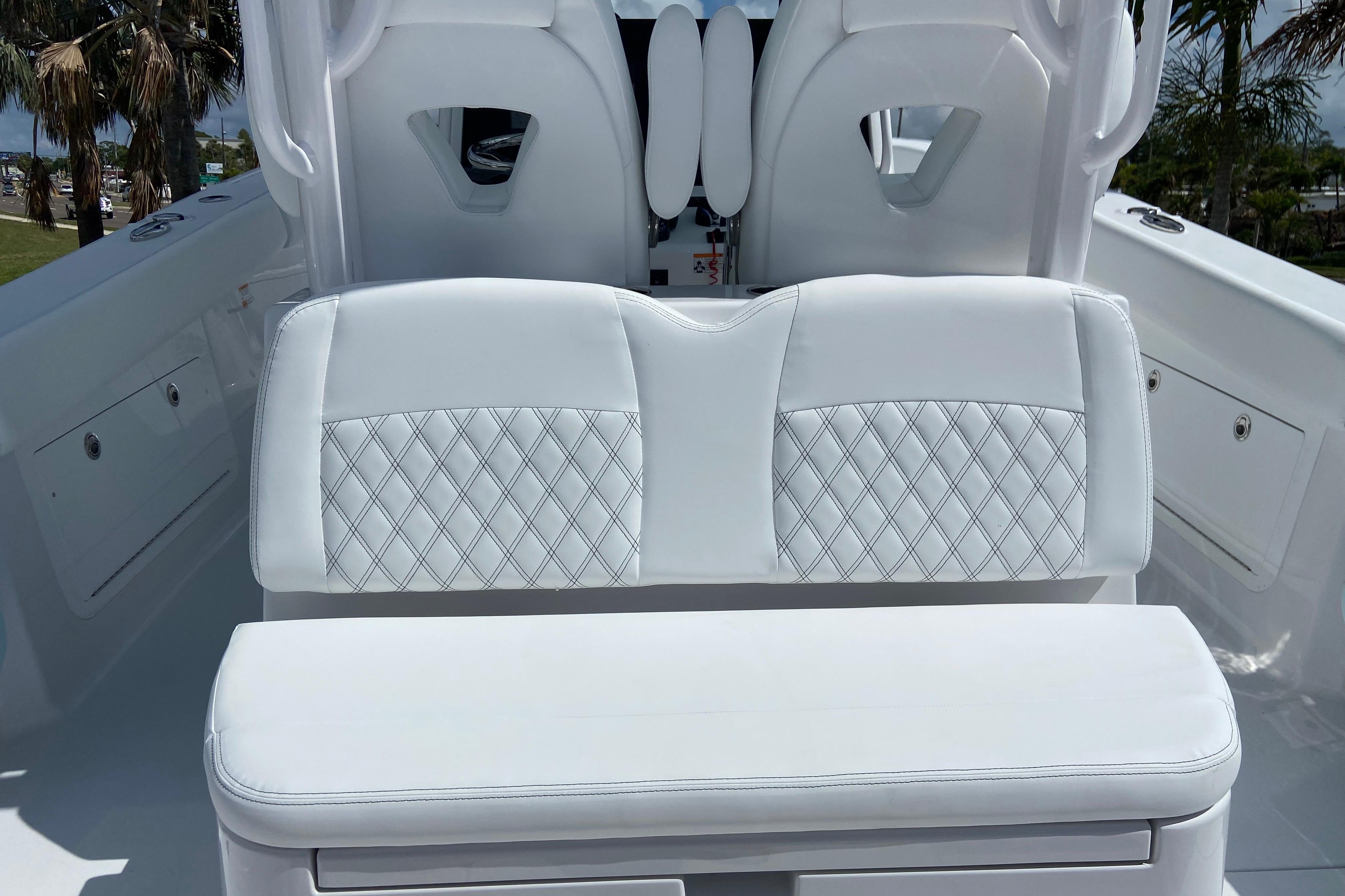 2026 Sportsman Heritage 321 Center Console boat with white cushioned seating and diamond stitching.