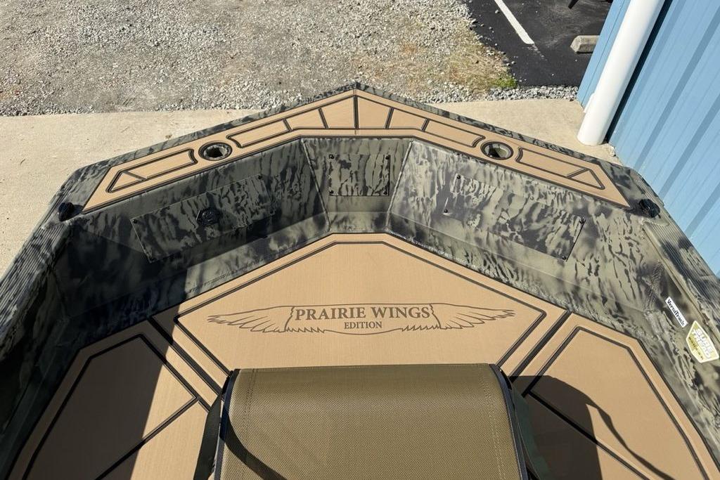 2026 Tracker Grizzly 1650 T Prairie Wings Edition boat interior with camouflage design.