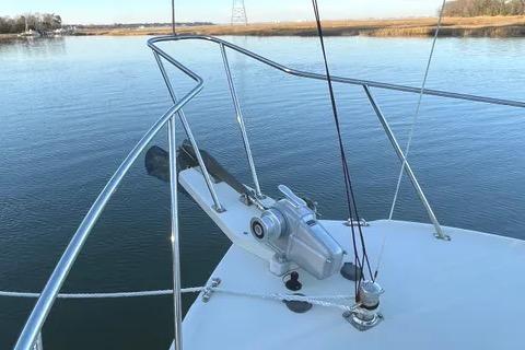 1997 Rosborough Trawler bow with anchor and winch on calm water.