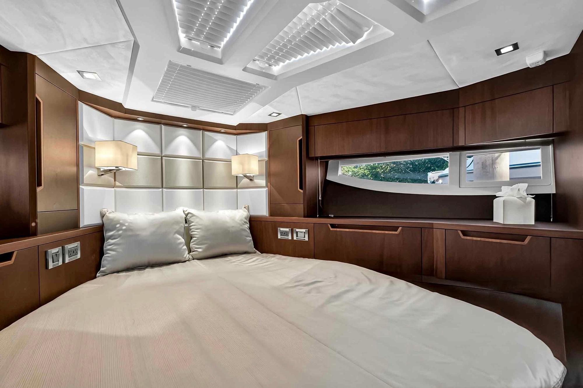 Luxurious bedroom interior of 2021 Galeon 500 Fly yacht with modern design elements.
