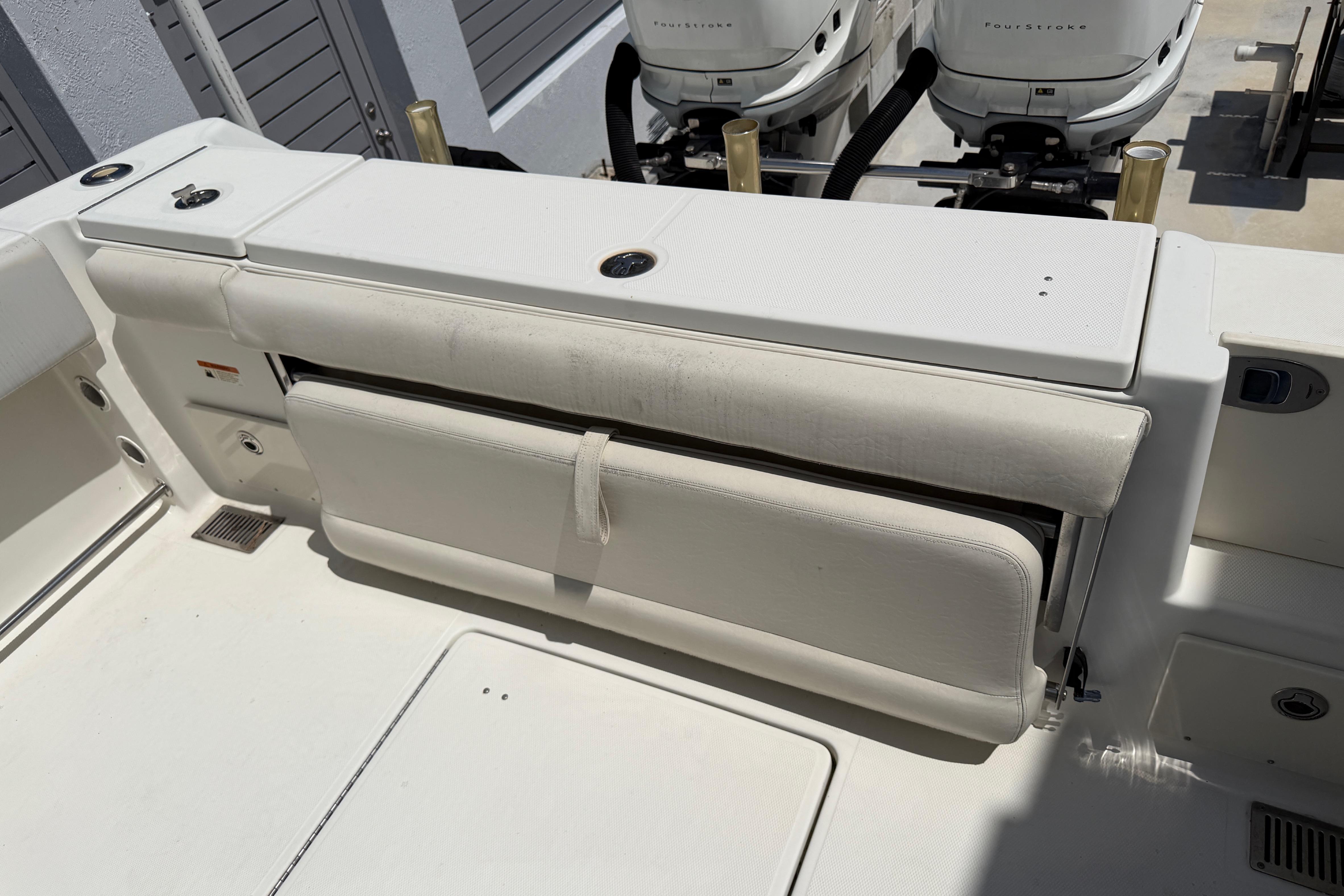 2008 Hydra-Sports Vector 2900 CC boat interior with foldable seating and dual outboard engines.