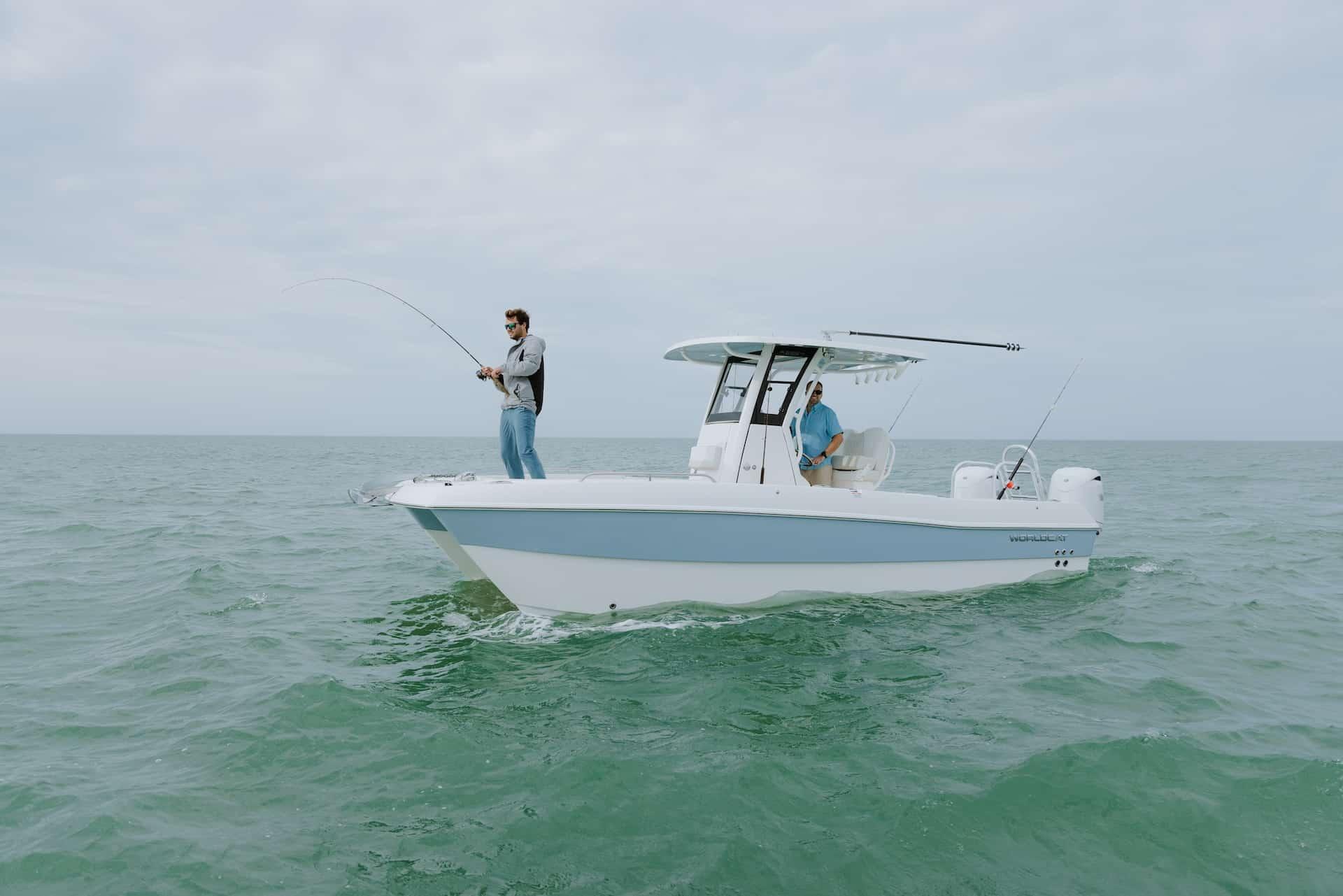 2026 World Cat 235TE boat with people fishing on open water.