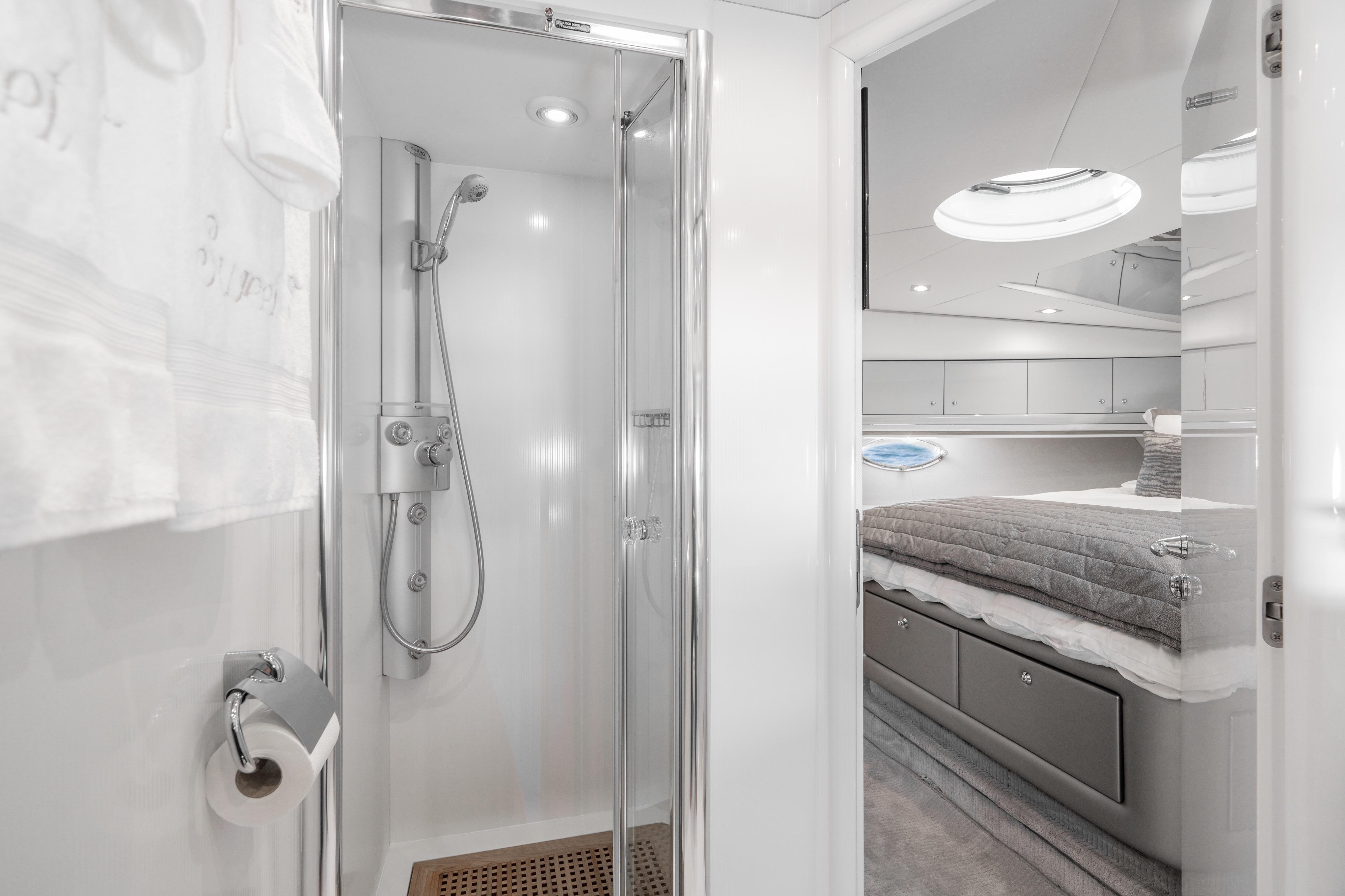 Luxurious bathroom and bedroom interior of 2021 Sunseeker Predator 68 yacht.