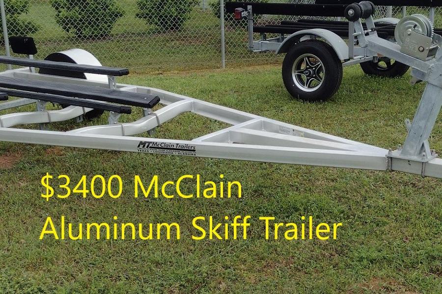$3400 McClain aluminum skiff trailer on grass, Delta Boatworks 1550, 2027 model.