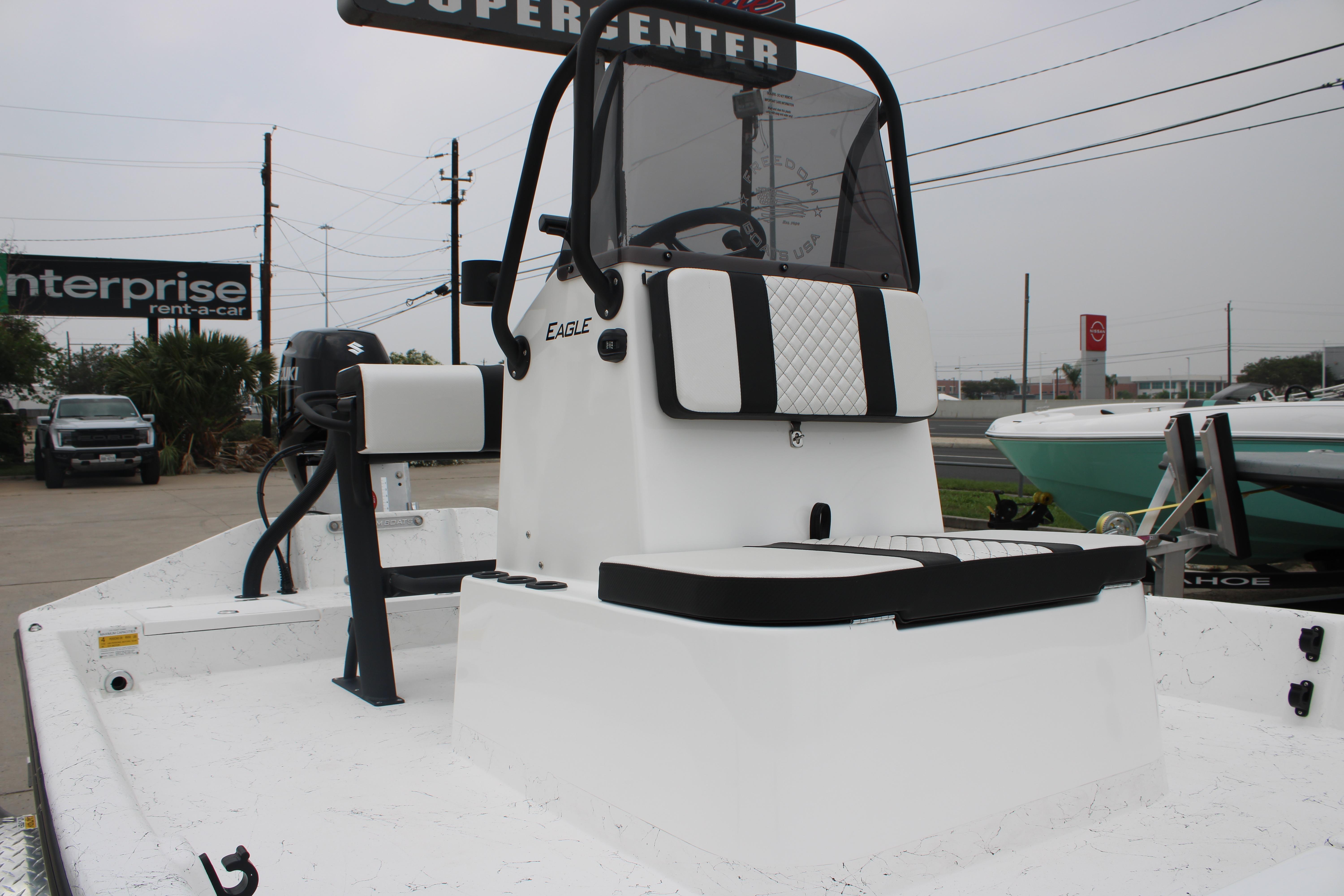 2026 Freedom Boats 16' Eagle with Suzuki motor, displayed at a dealership.