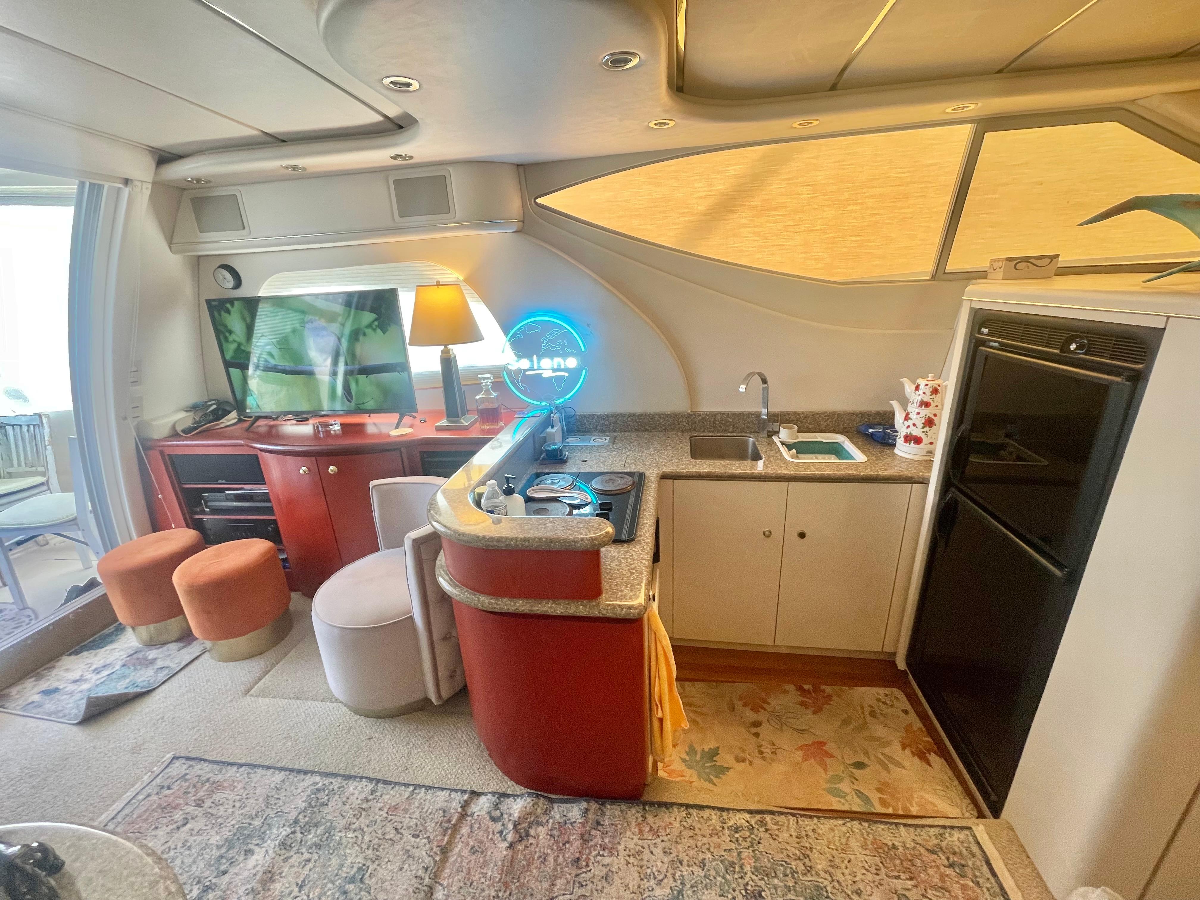 Luxurious interior of a 1998 Maxum 4100 SCA yacht with modern amenities.