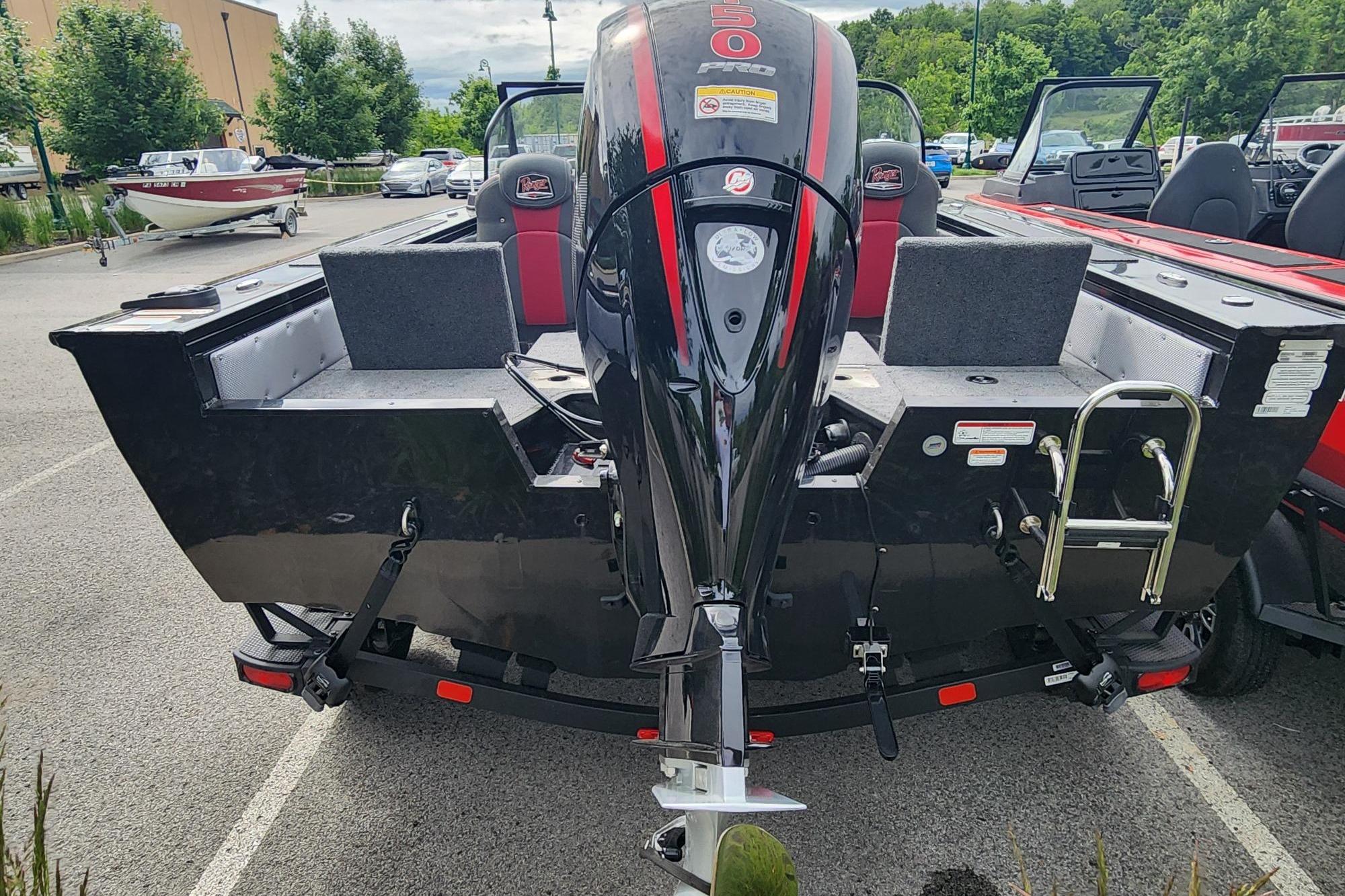 2026 Ranger VX1788 WT boat with powerful outboard motor in a parking lot.