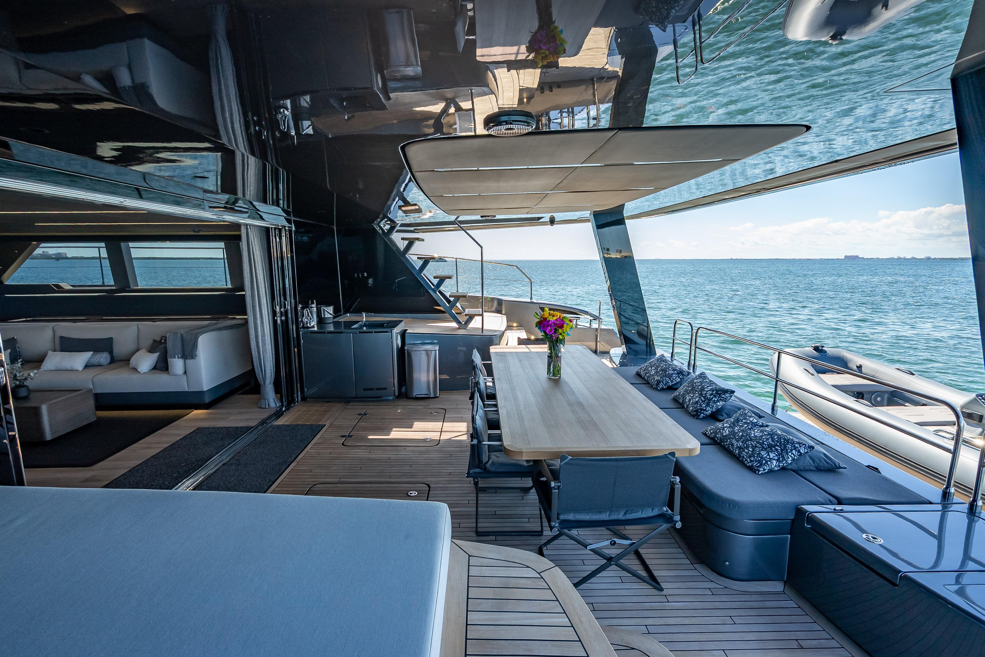 Luxurious Sunreef 60 Power yacht interior, featuring elegant seating and dining area with ocean view.