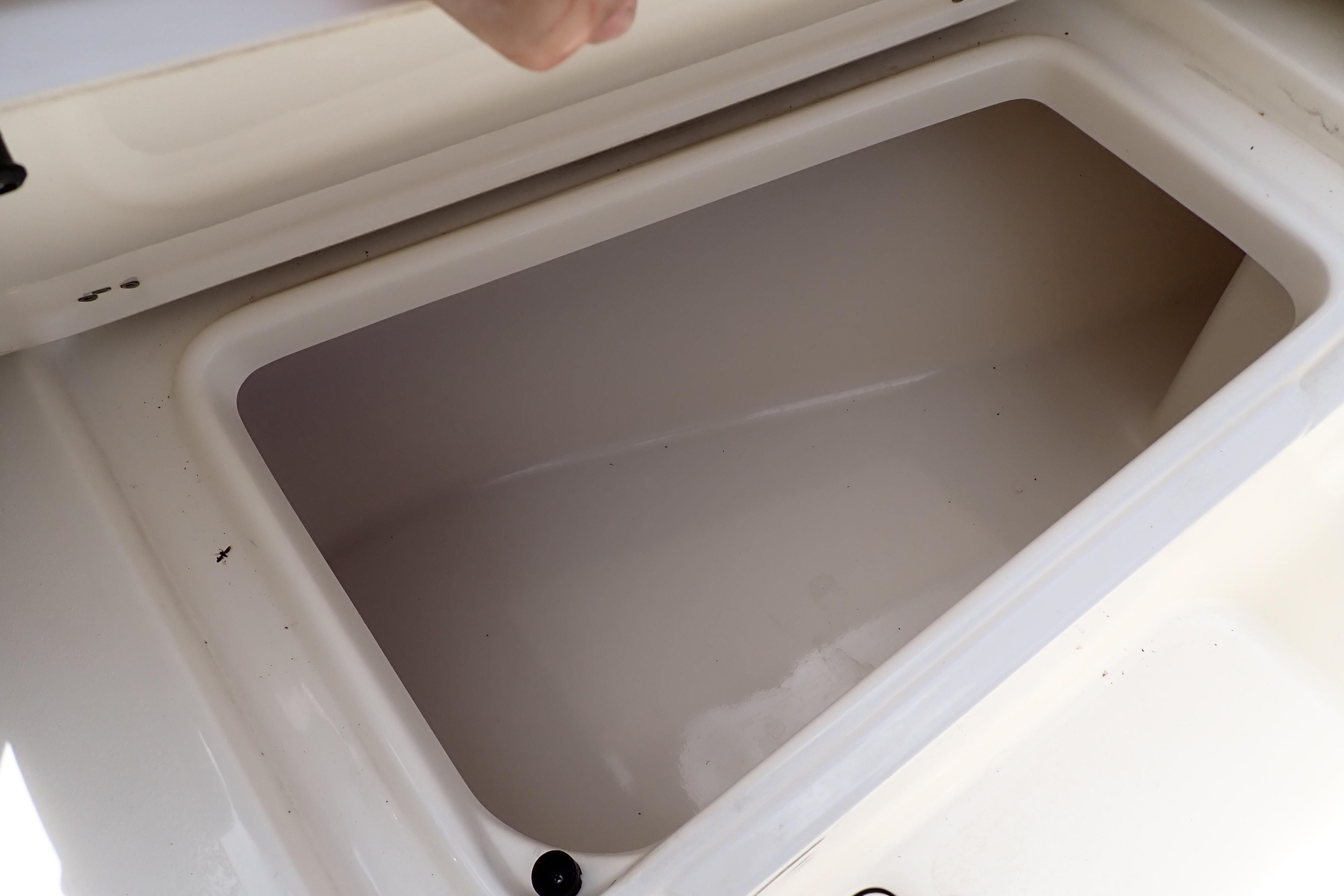 Open storage compartment on a 2019 Key West 263 FS boat.