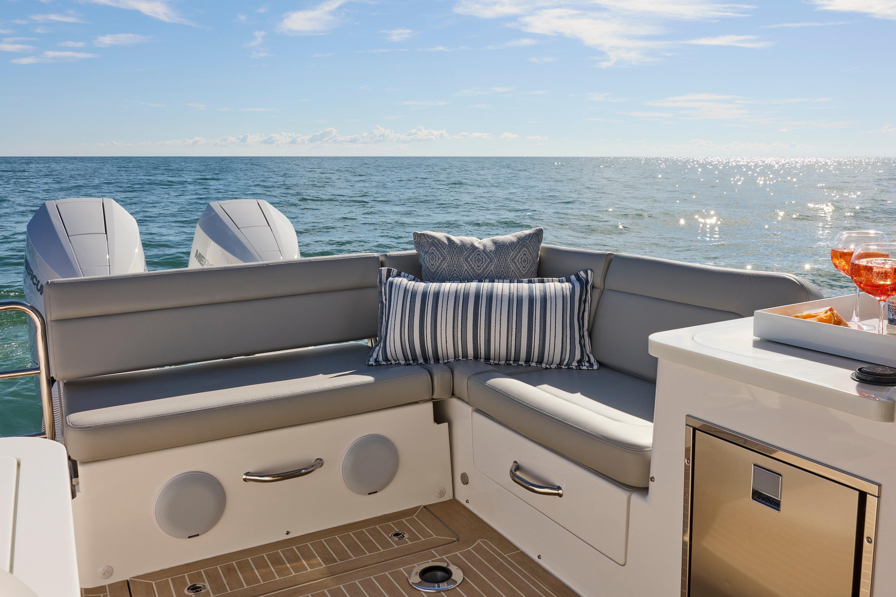 Luxury seating on MJM 38x boat, ocean view, 2026 model, with drinks and snacks.