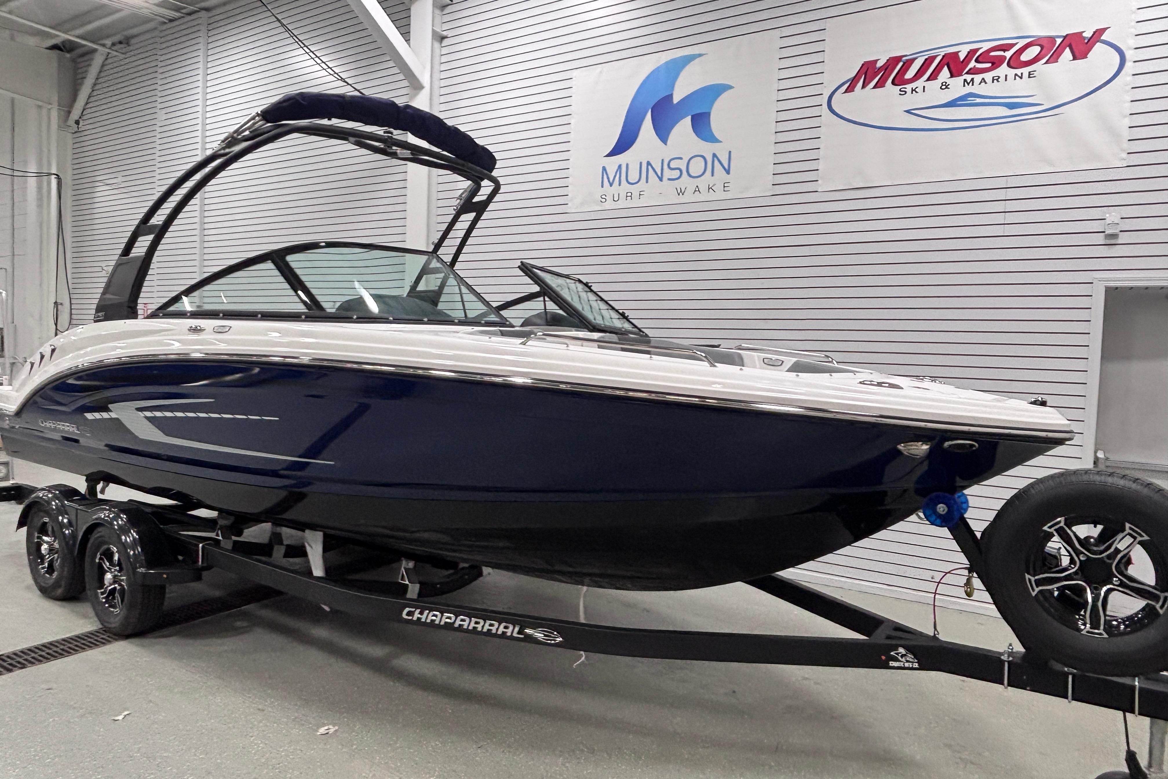 2026 Chaparral 23 SSi boat on trailer in showroom, Munson Ski & Marine.