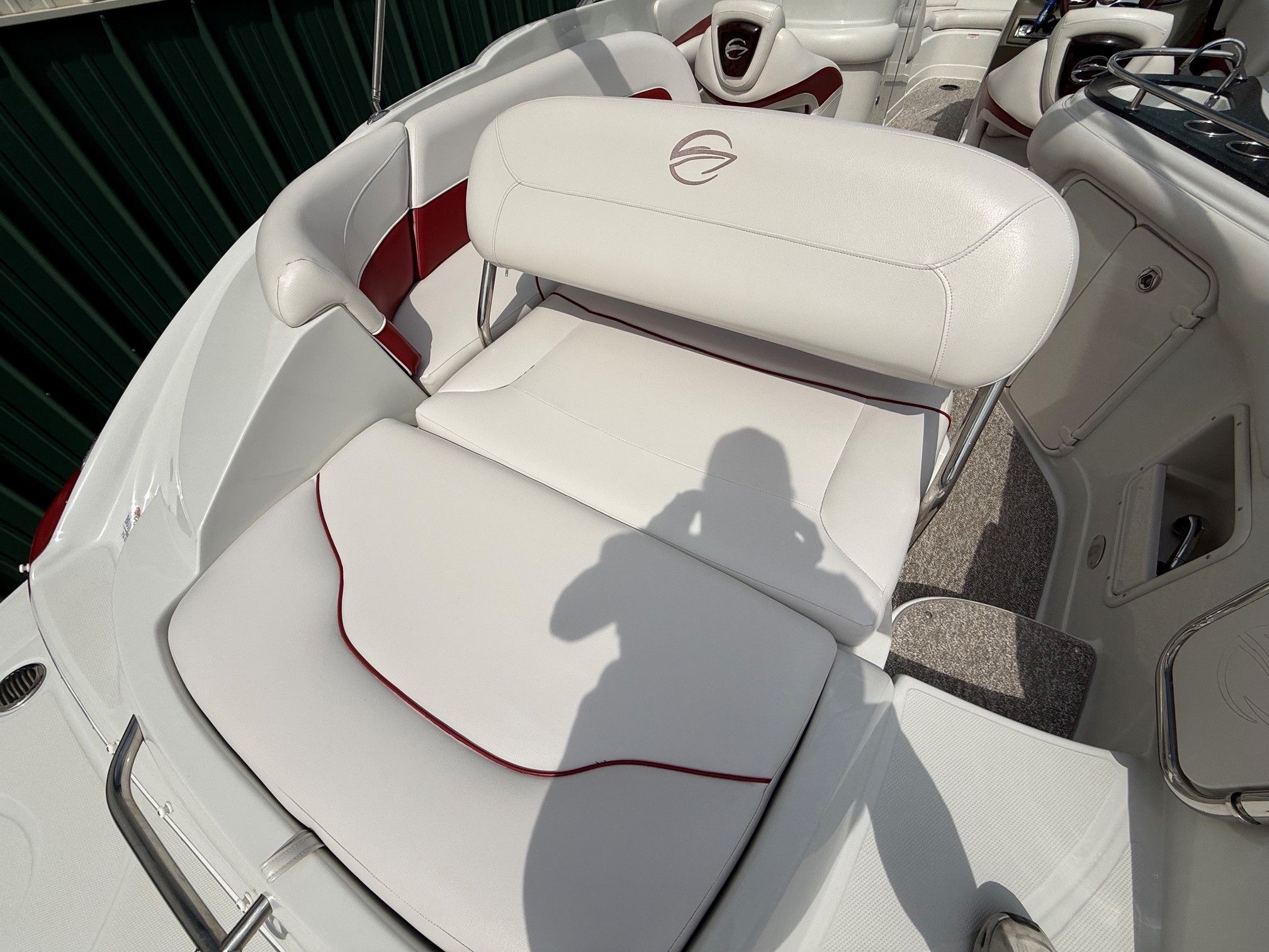 The image shows the white and red upholstery of a 2012 Crownline 252 EX.