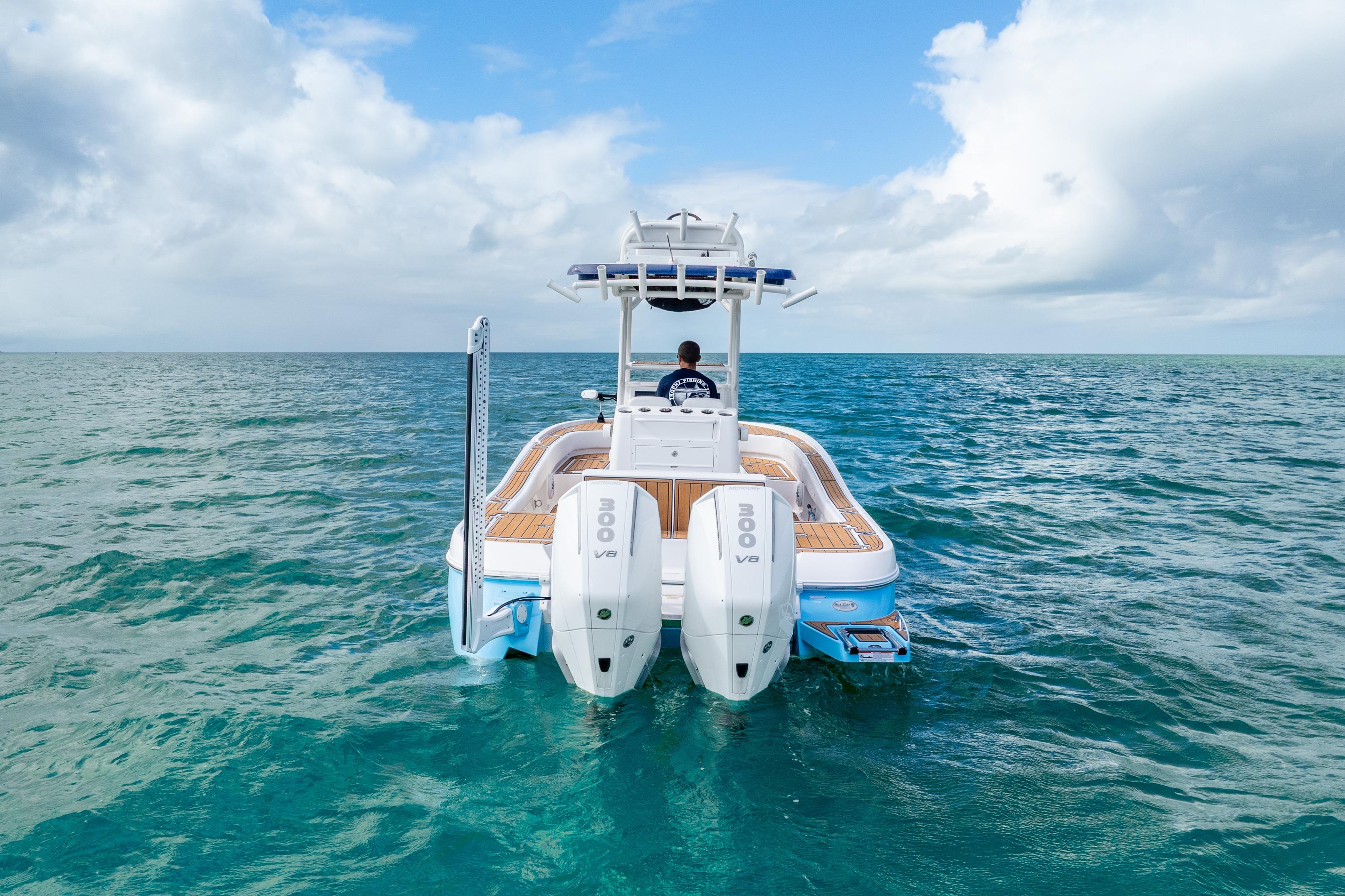 2024 Caymas 281 HB boat on open ocean, featuring dual 300 V8 engines.