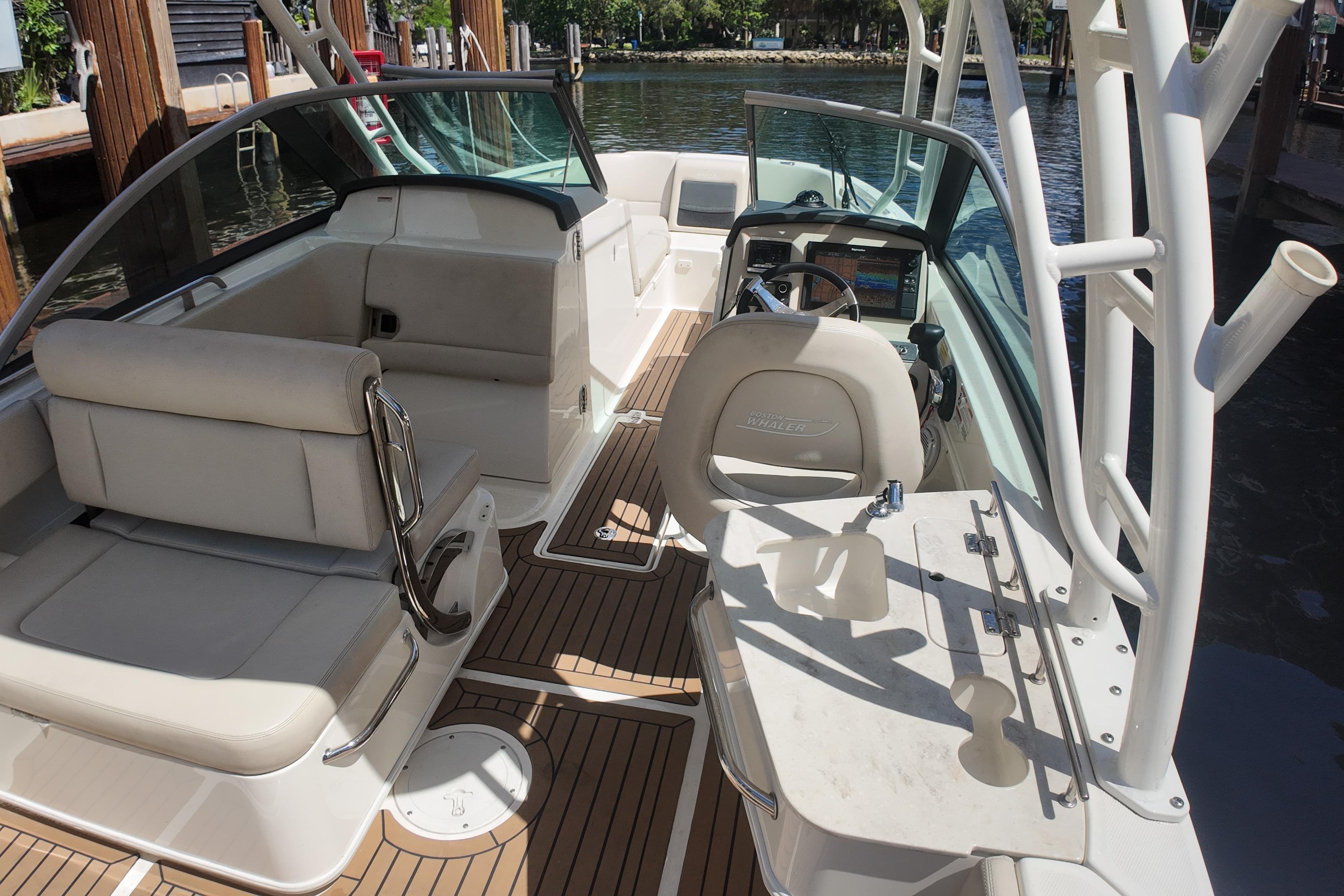 2017 Boston Whaler 230 Vantage boat interior with seating and steering wheel.