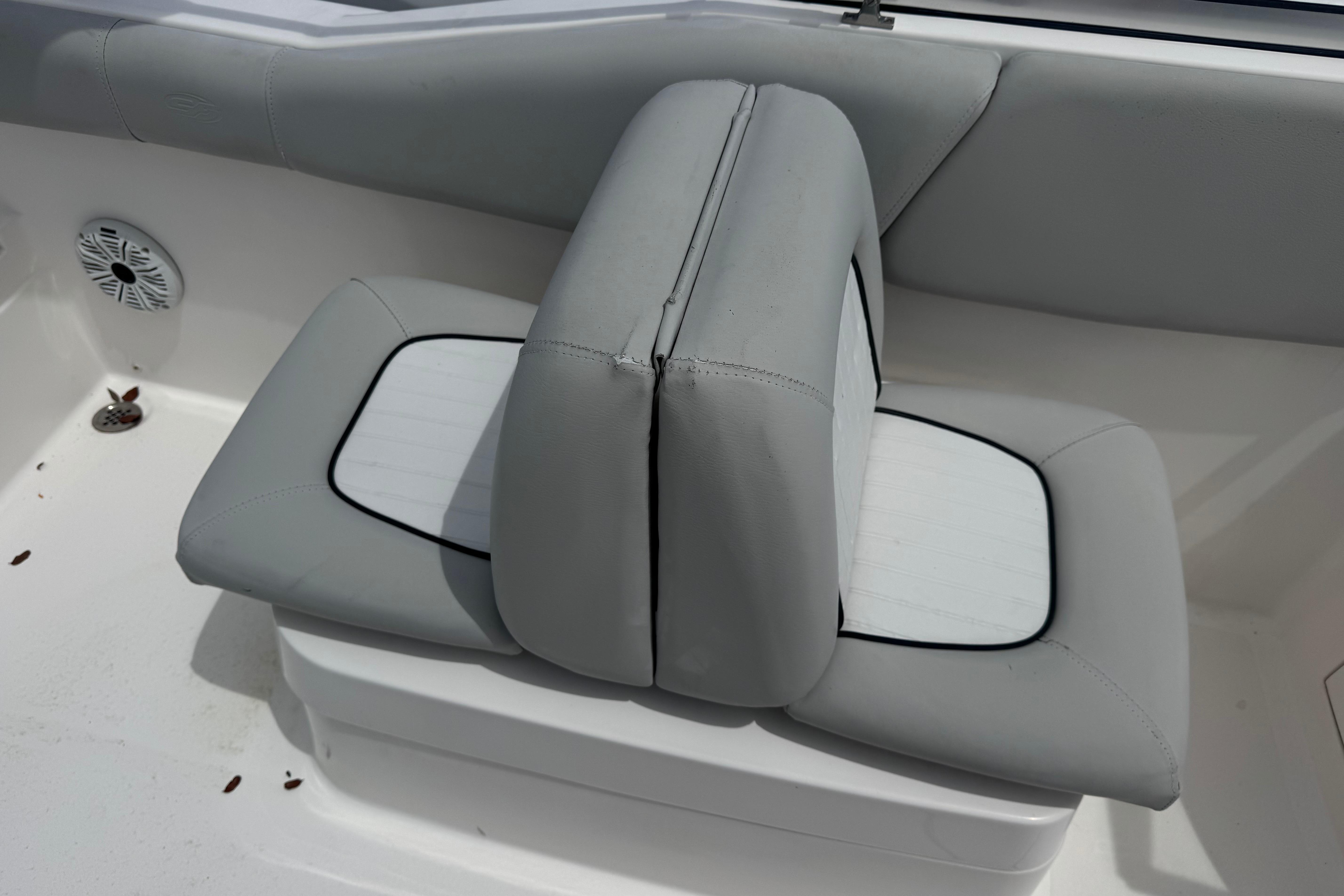 2020 Sea Fox 226 Traveler boat seat with gray upholstery and speaker detail.