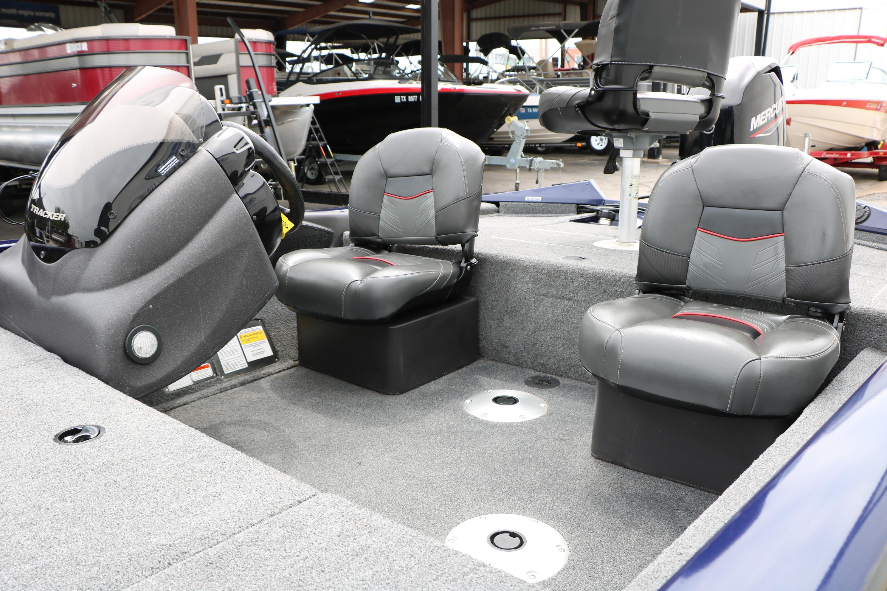 2022 Tracker Pro Team 175 TF boat interior with two cushioned seats and steering console.