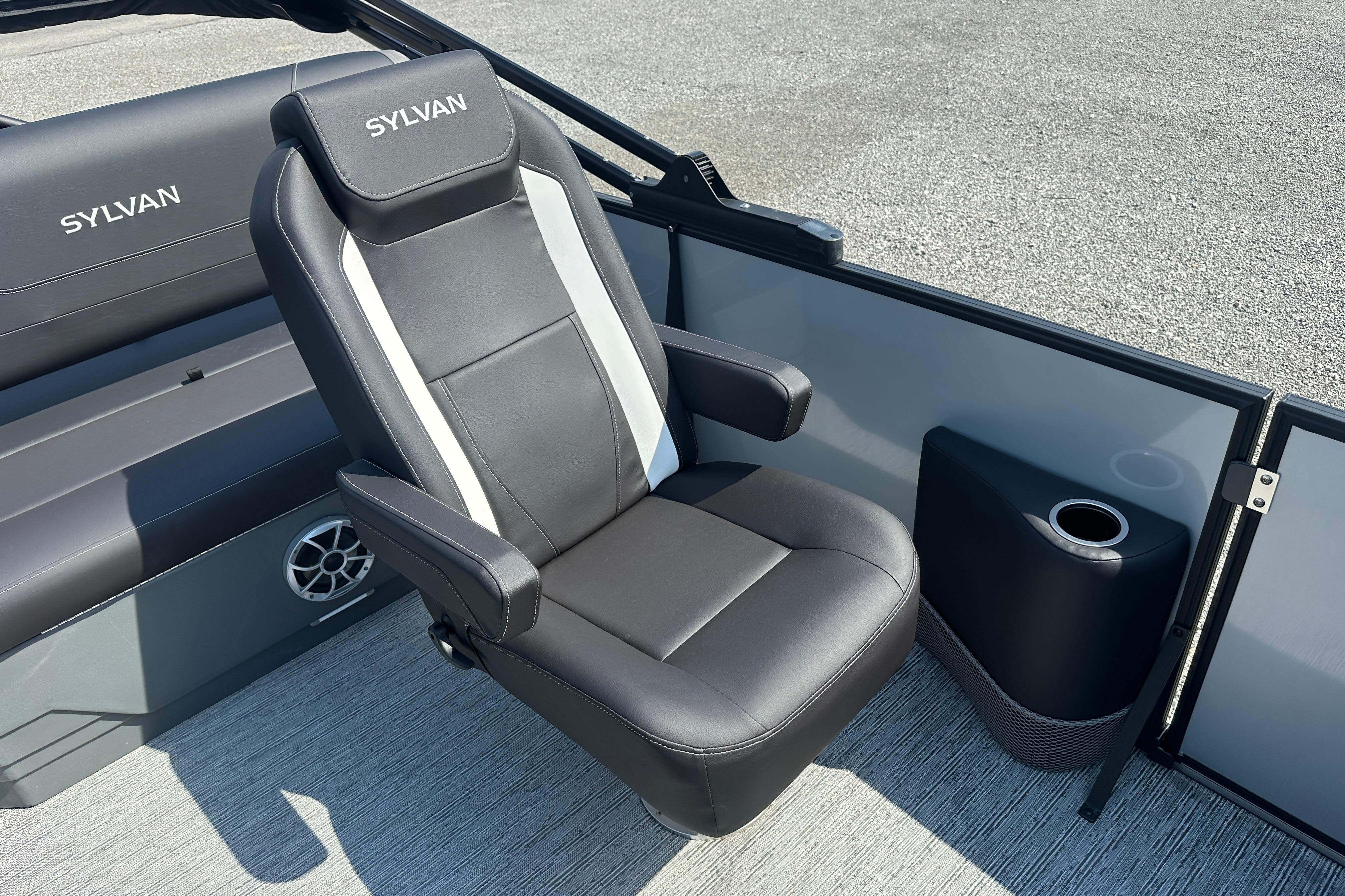 Luxurious seating on 2026 Sylvan X3 CLZ DH boat, featuring sleek black and white design.