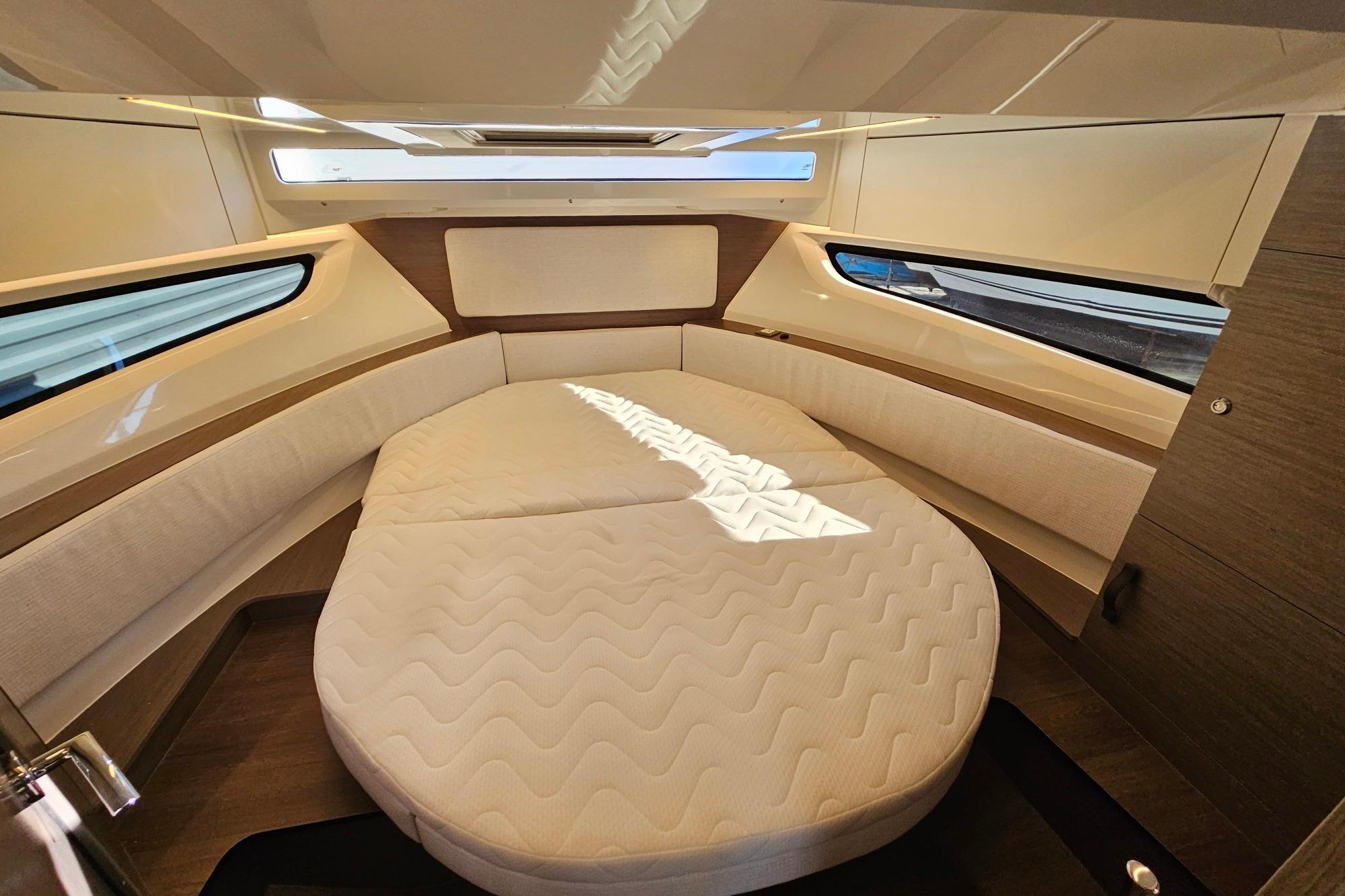 Luxurious cabin interior of 2026 Jeanneau Merry Fisher 1095 Fly Serie 2 yacht.