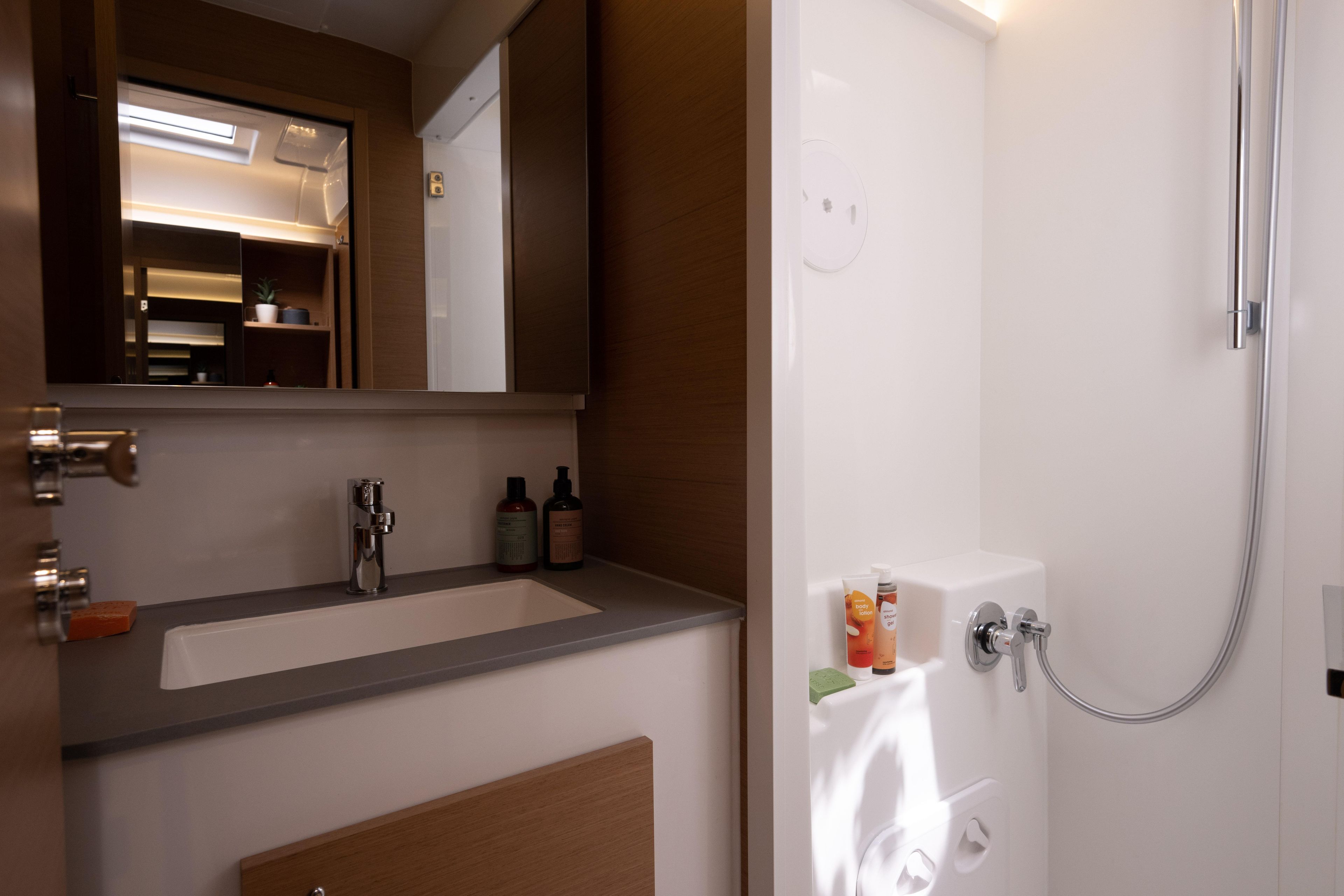 Modern bathroom interior of Excess EXCESS 14 yacht, featuring sleek sink and shower area, 2026 model.