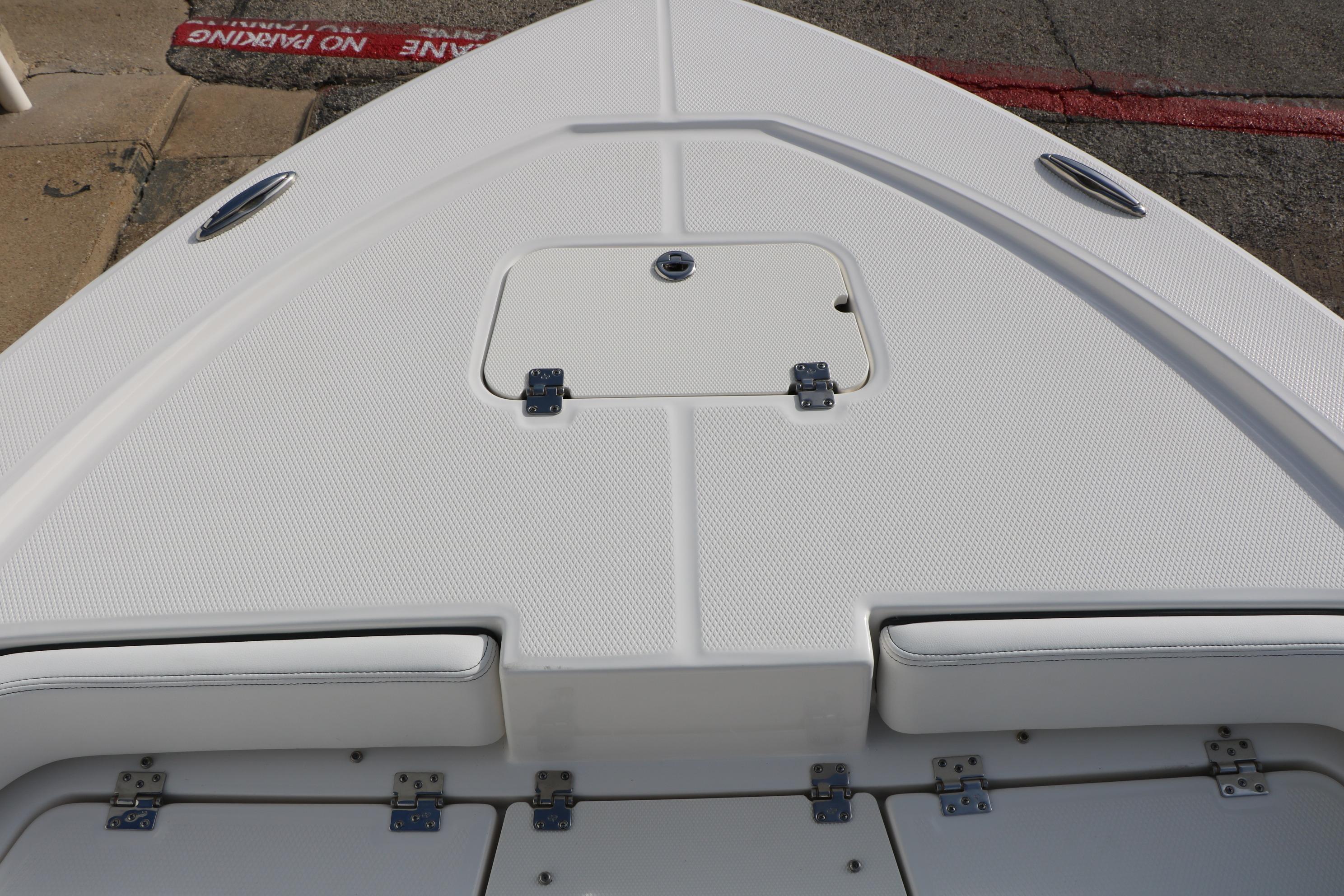 2026 Robalo 206 Cayman boat deck with storage hatch and seating.