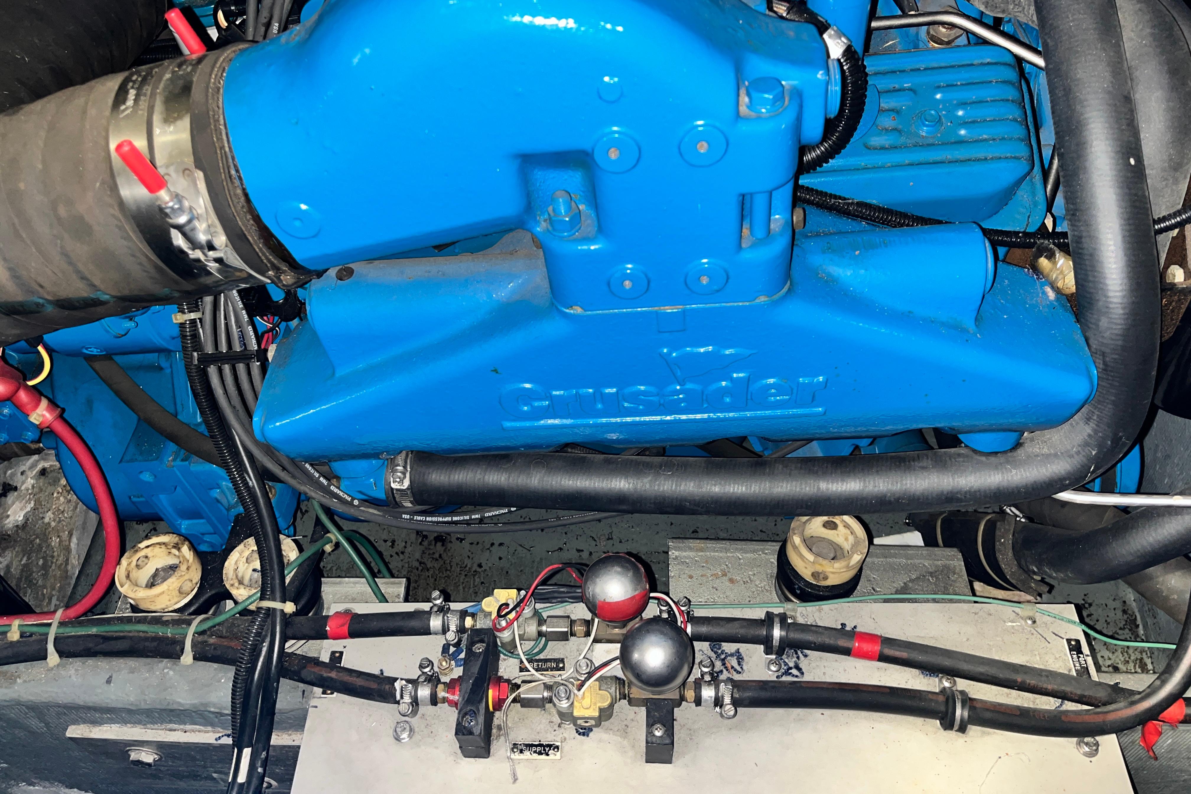 Engine of 1995 Carver 325 Aft Cabin Motor Yacht, featuring blue Crusader components.