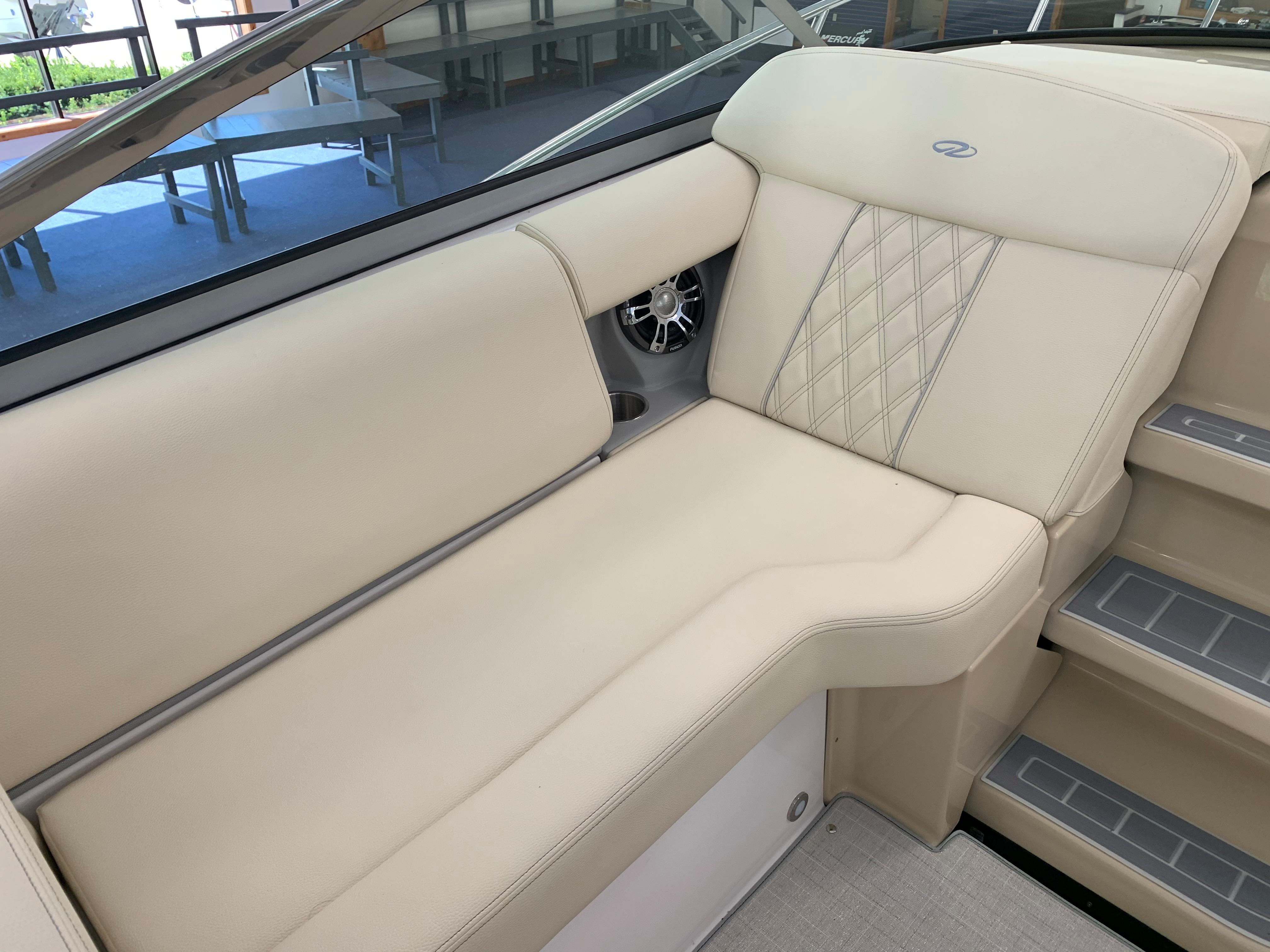 2021 Regal 33 Express boat interior with beige seating and diamond stitching.