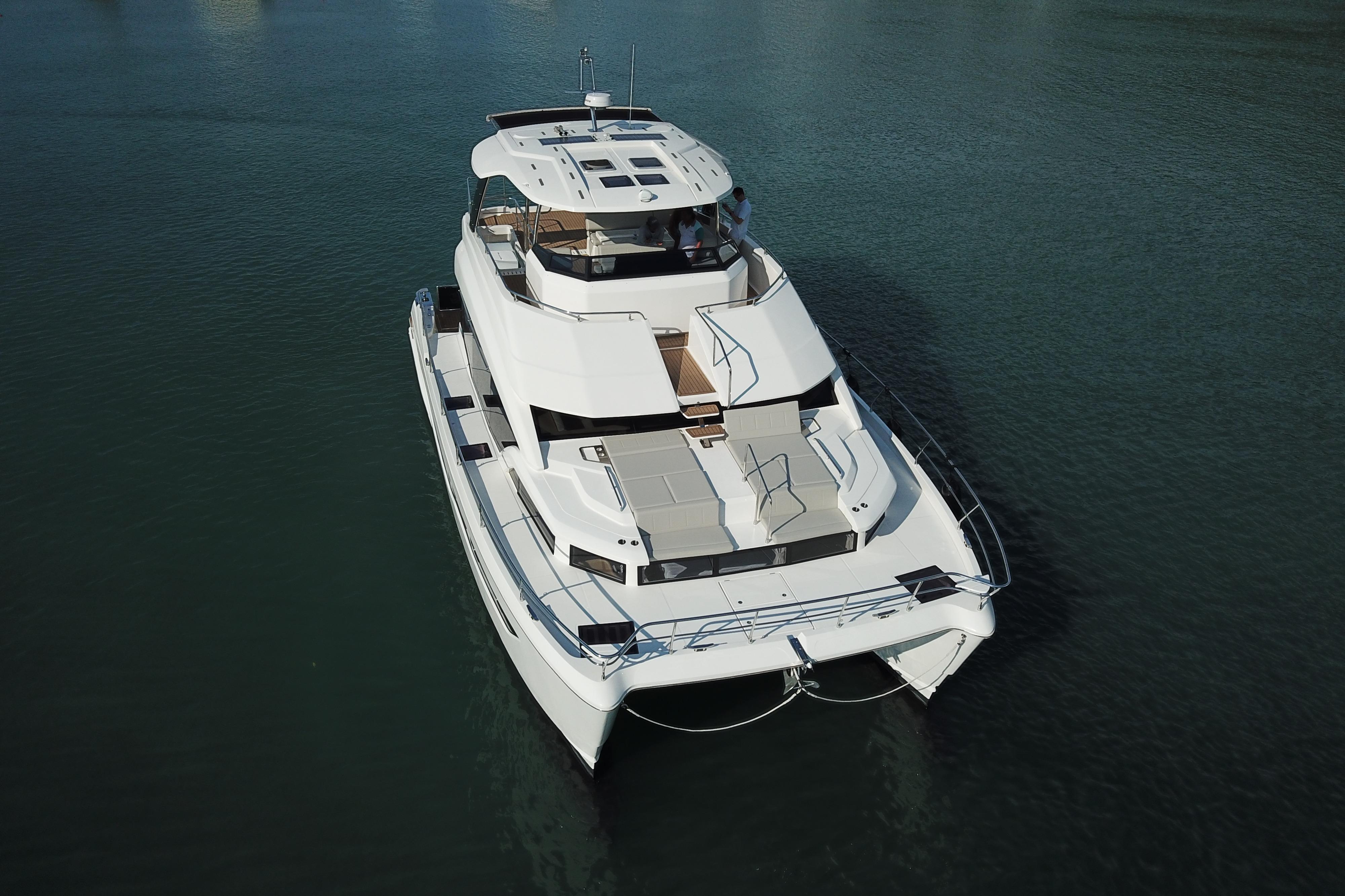 2025 Aquila 54 Yacht on calm water, aerial view.