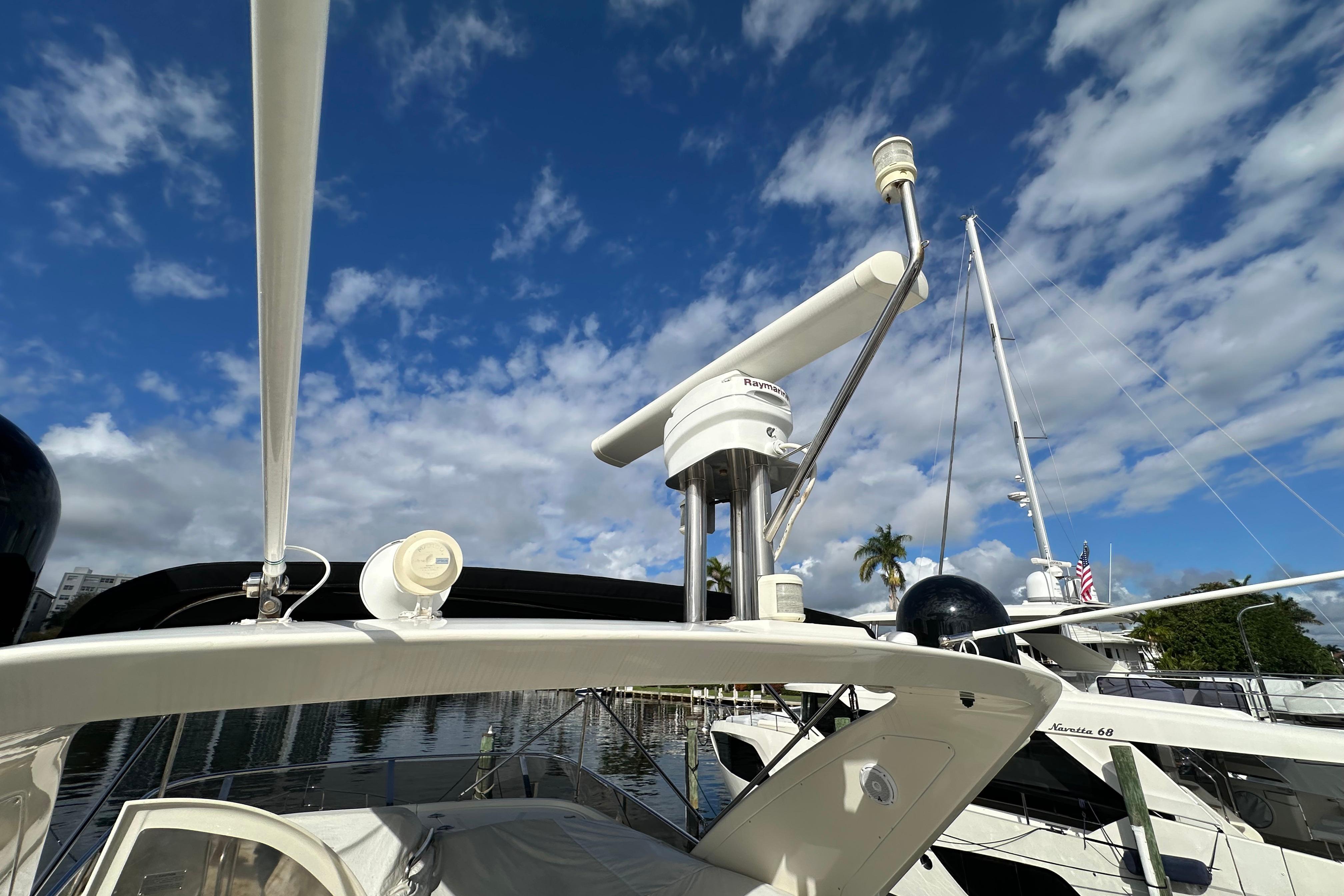 2004 Azimut 55E yacht radar and navigation equipment under a clear blue sky.