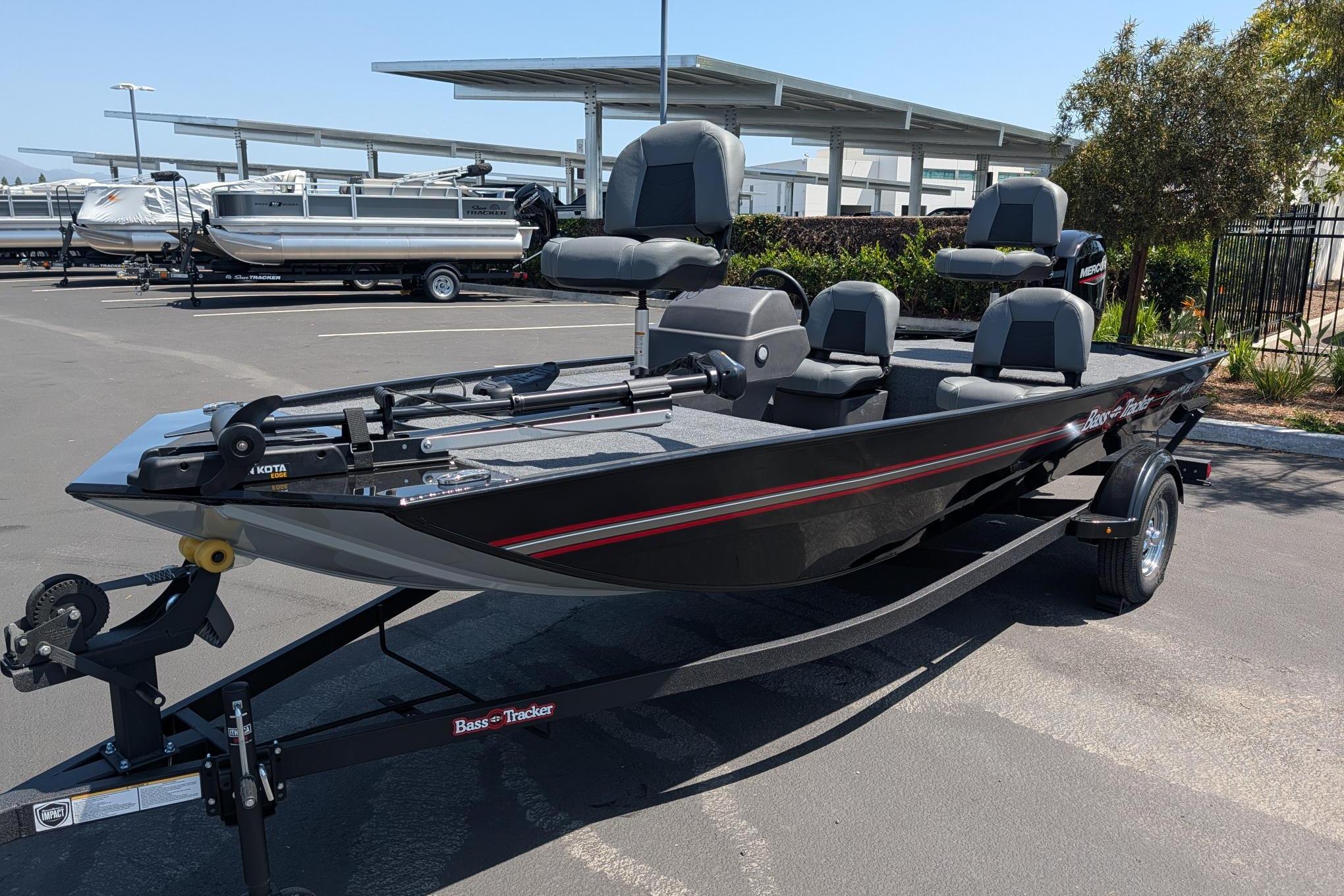 2026 Tracker Bass Tracker Classic XL boat on trailer in parking lot.