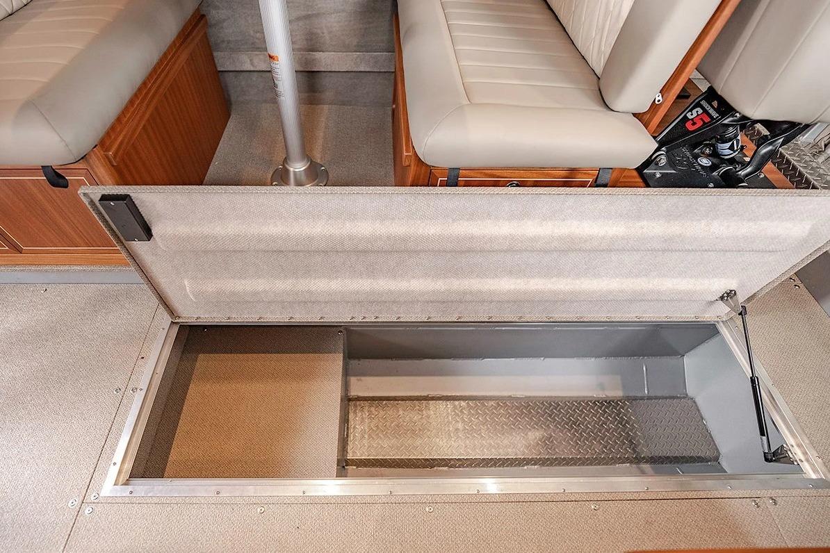 2026 KingFisher 3225 GFX Offshore boat interior with open storage compartment.