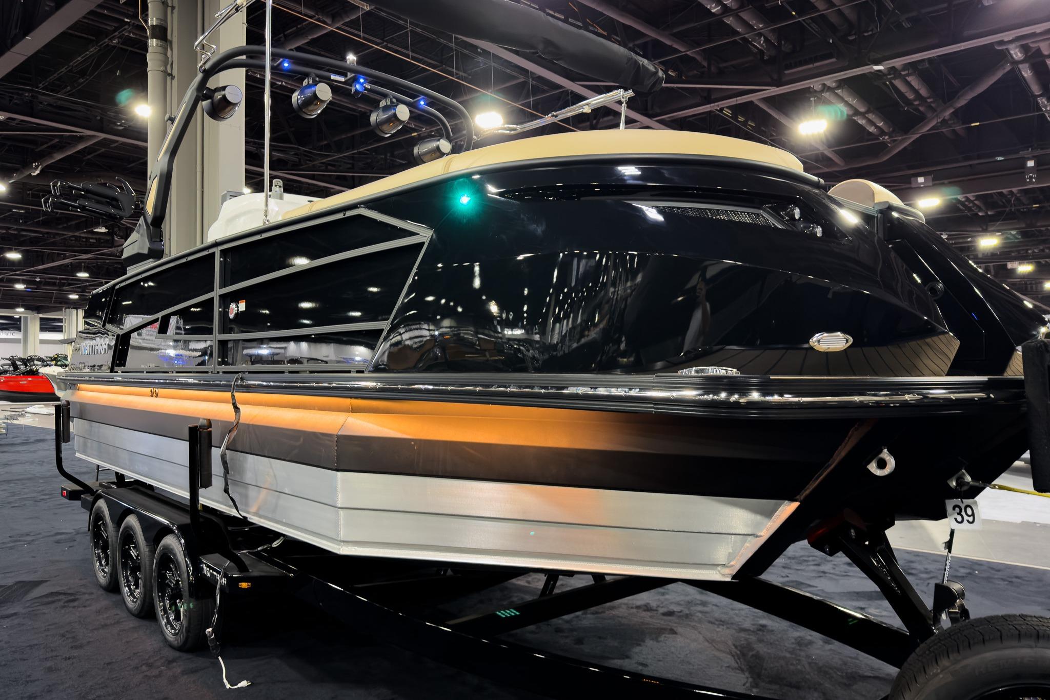 2026 Montara Surf Boss EVO SLDH 25' boat displayed indoors on a trailer.