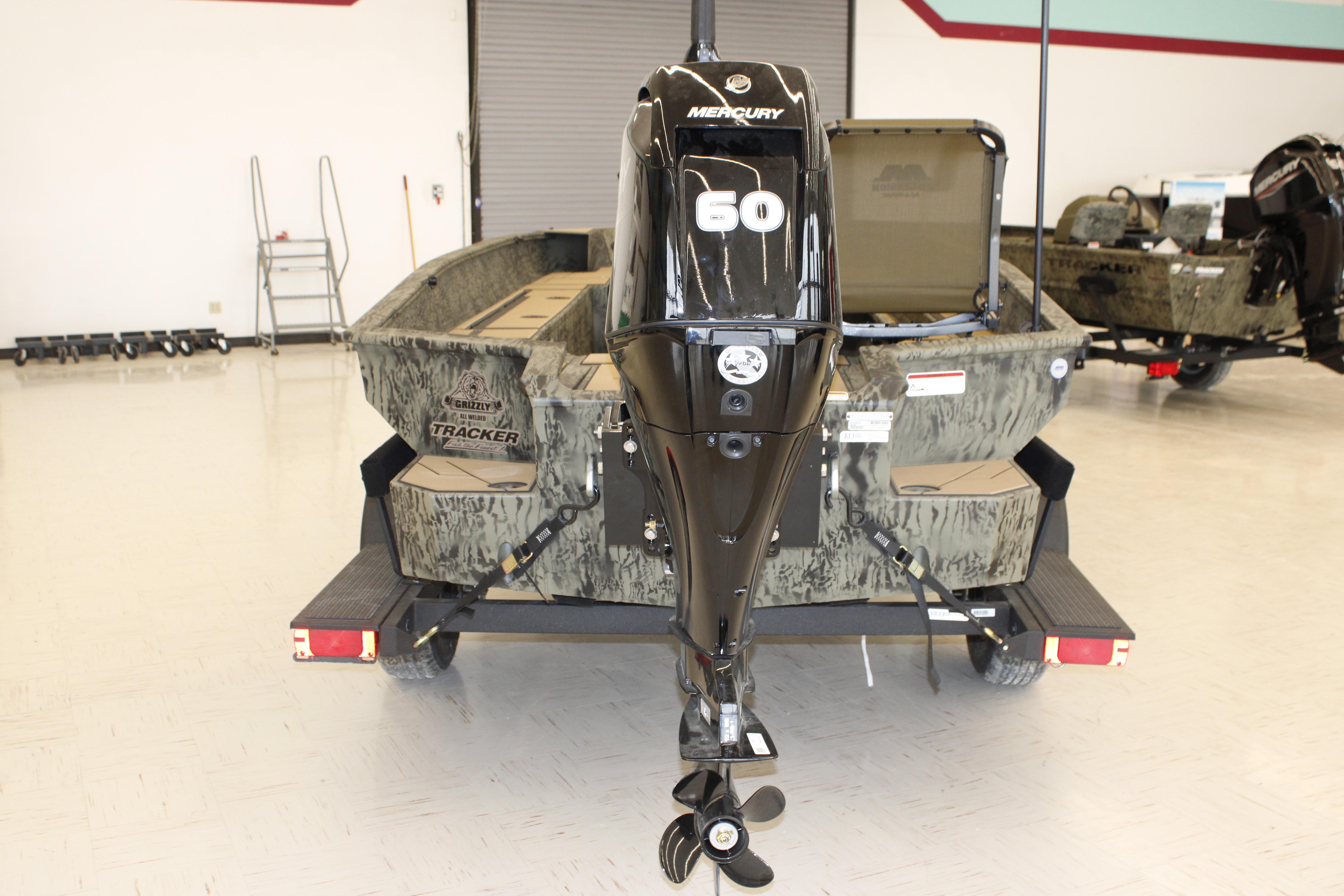 2026 Tracker Grizzly 1756 T Marsh boat with Mercury 60 engine in showroom.