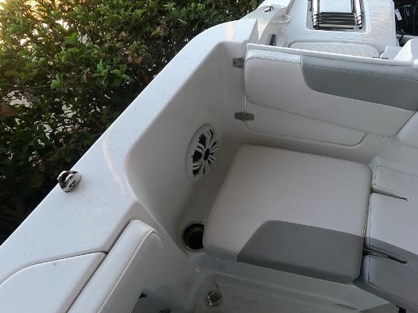 2023 Tahoe 2150 CC boat interior with white seating and speaker.