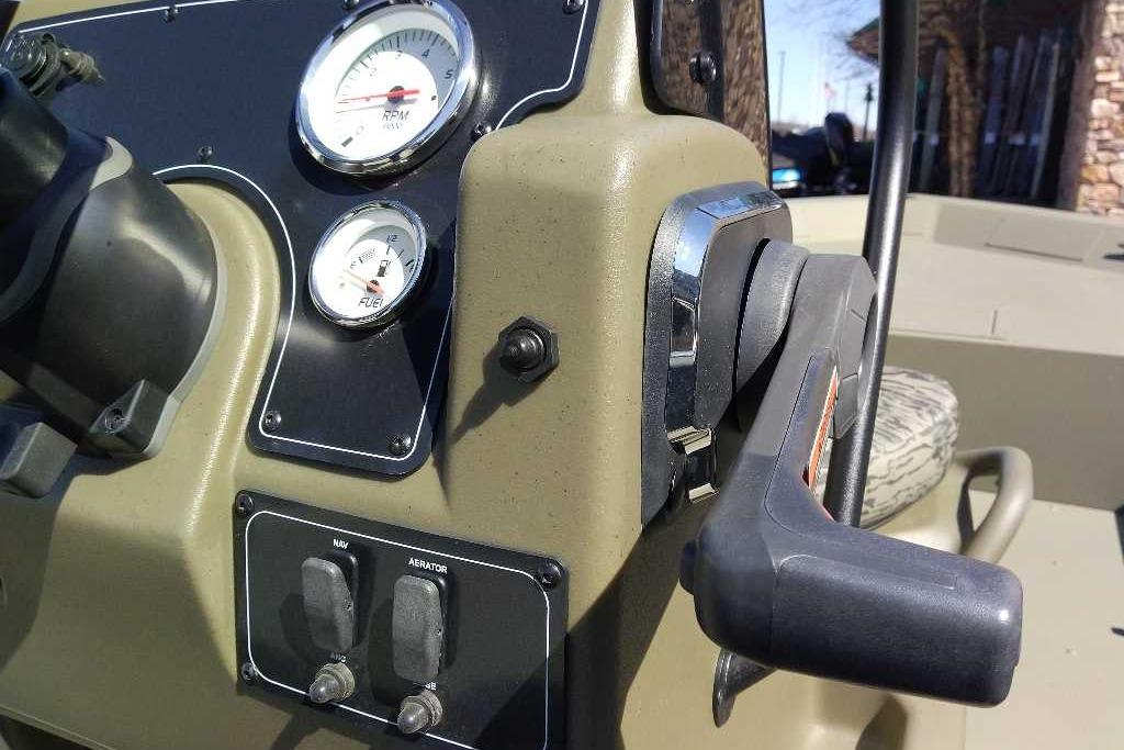 Dashboard of 2026 Tracker Grizzly 1860 CC boat with gauges and controls.