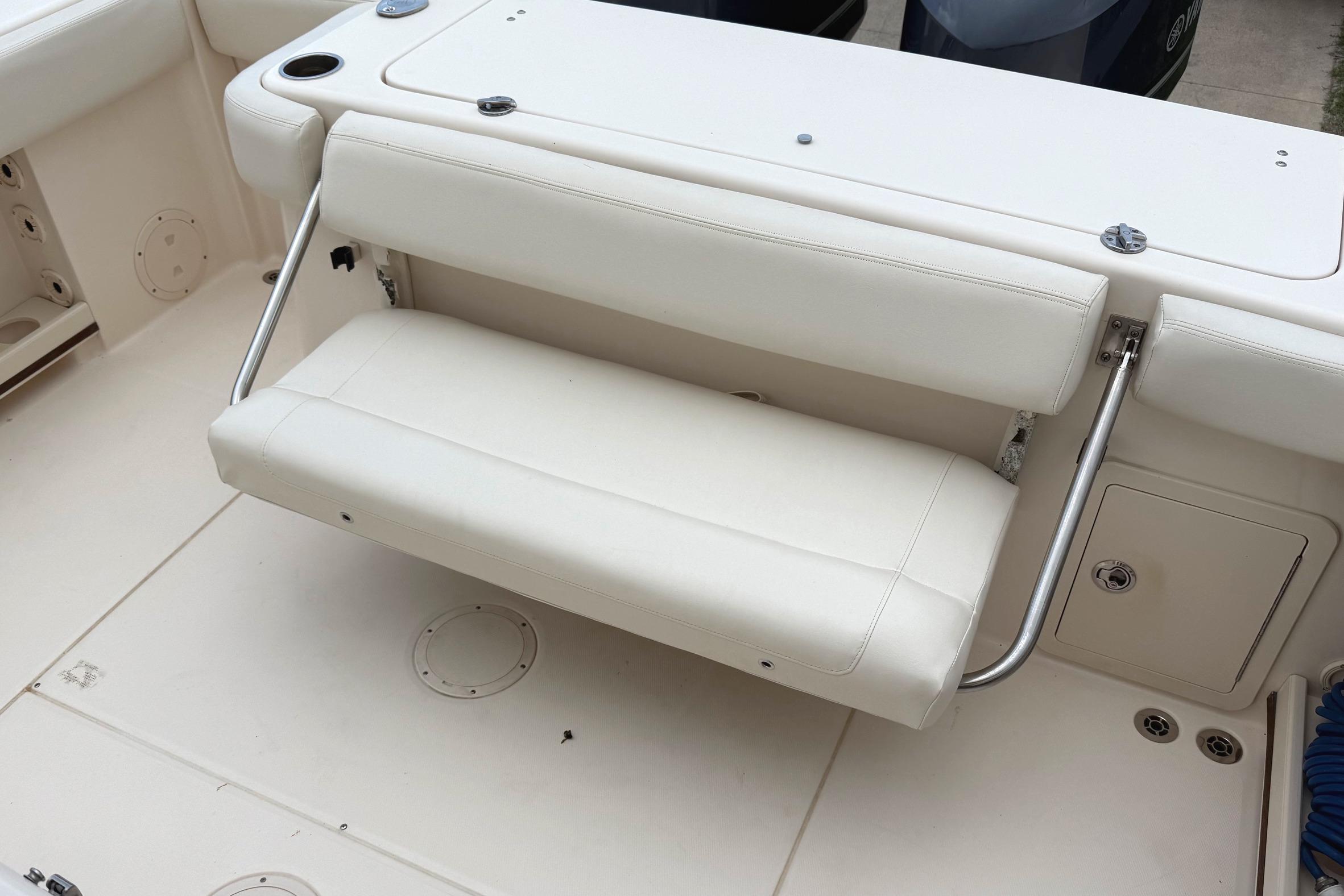 2018 Grady-White Canyon 306 boat with foldable white bench seat.