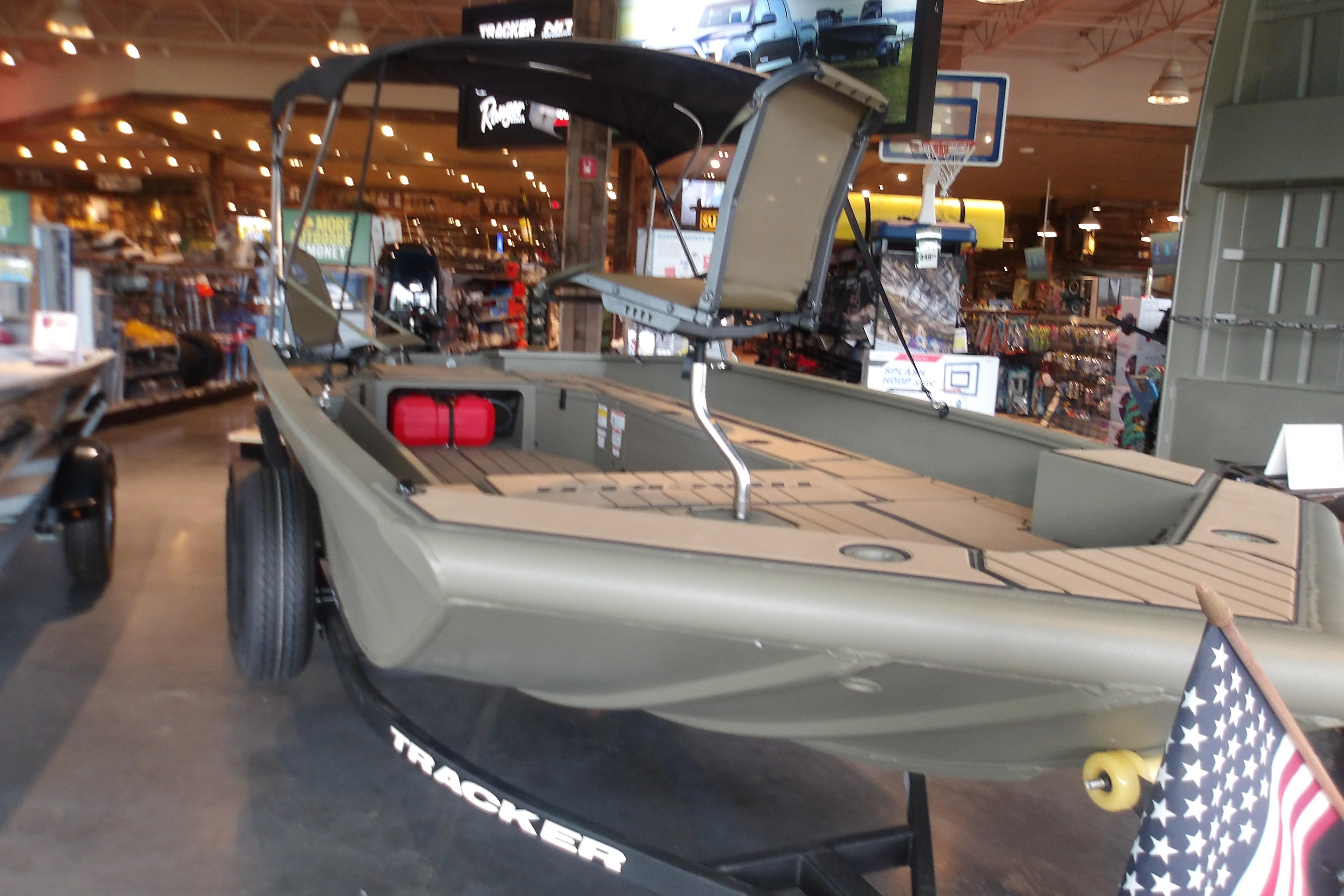 2026 Tracker Grizzly 1756 T Marsh boat displayed indoors, featuring a sleek design.