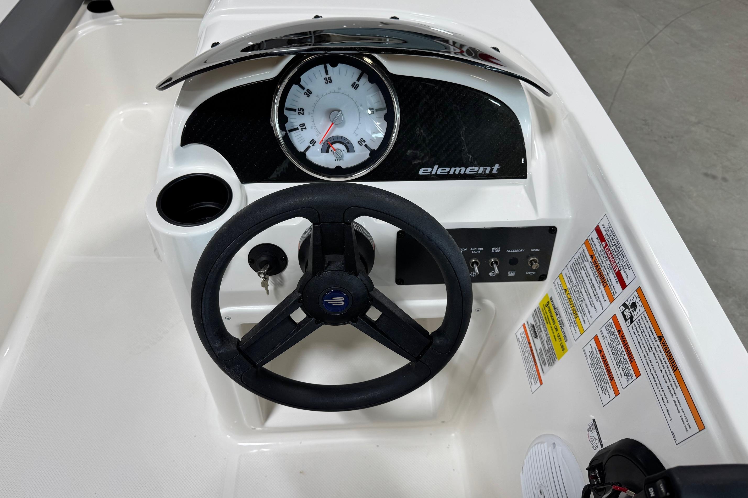 2026 Bayliner Element E18 dashboard with steering wheel and instrument panel.