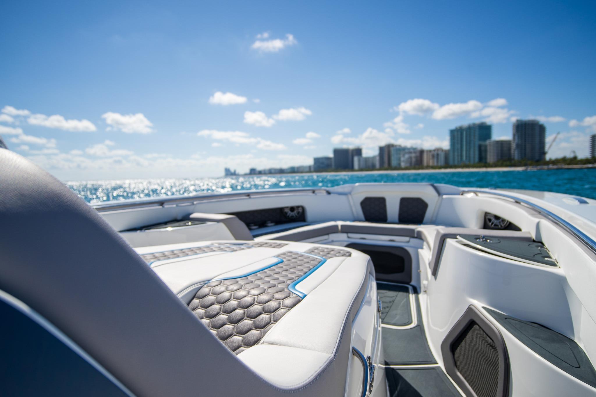 Luxurious MTI 50v boat interior with city skyline and ocean view, 2023 model.